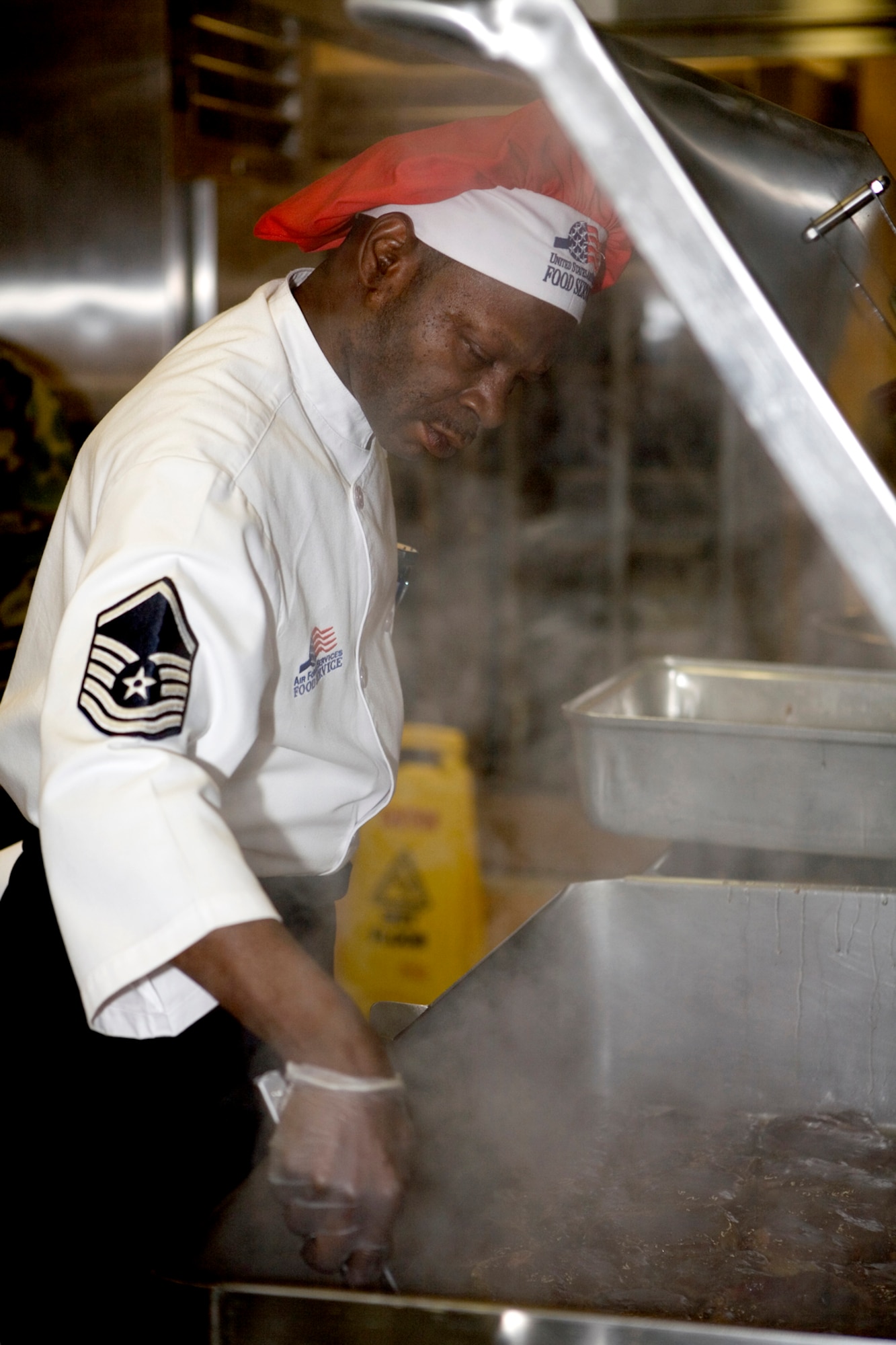 GRISSOM AIR RESERVE BASE, Ind.-- Master Sgt. Kent Williams, 434th Services Flight food services supervisor, makes steak for dinner during a recent unit training assembly. Service supervisors maintain proficiency by helping out in the kitchen whenever possible. Services will be competing for the John L. Hennessy Trophy which is awarded to the best food-service program in the Air Force. (U.S. Air Force photo/Senior Airman Omar Delacruz)