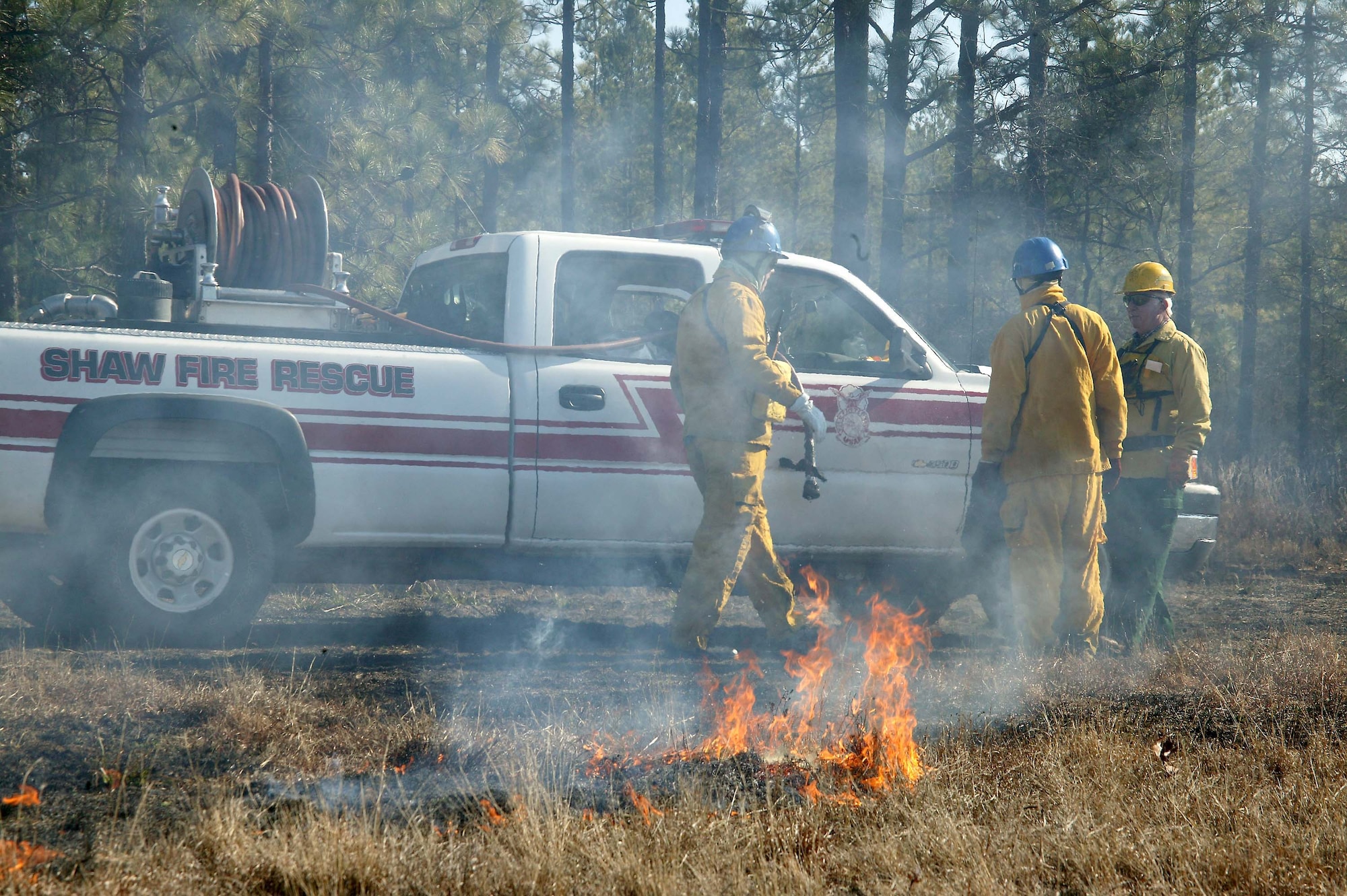 SHAW AIR FORCE BASE, S.C. -- Members of the 20th Civil Engineer Squadron perform a prescribed fire at Poinsett Electronic Combat Range Jan. 15. The main purpose for the prescribed burn is fuel reduction and to provide training for the 20th CES Fire Department. Approximately 52 acres were burned to prevent wildfires. (U.S. Air Force photo/Staff Sgt. John Gordinier)
