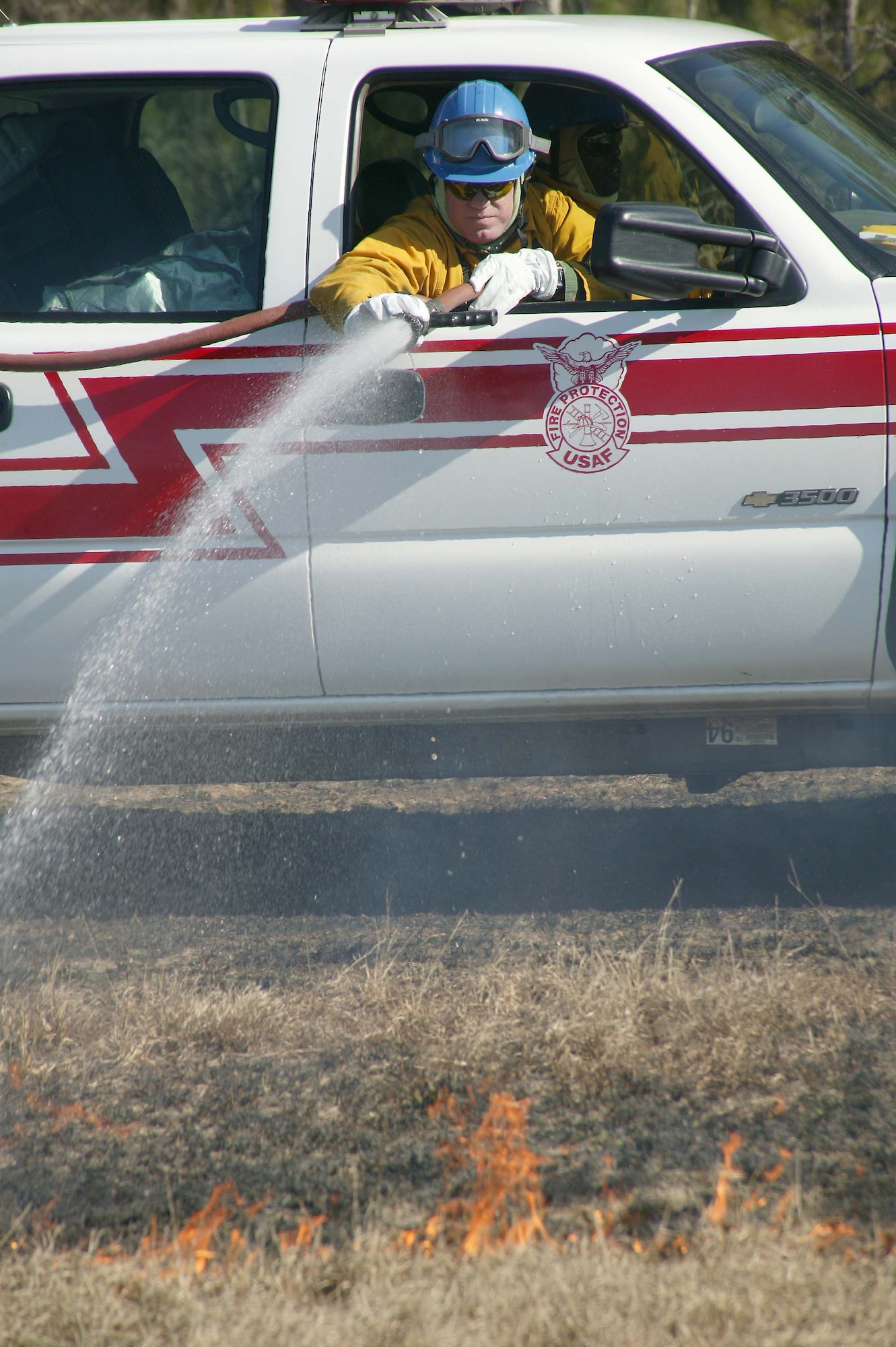 SHAW AIR FORCE BASE, S.C. -- Tech. Sgt. Phil Clark, 20th Civil Engineer Squadron firefighter, extinguishes the flames during a prescribed burn at Poinsett Electronic Combat Range Jan. 15. The main purpose for the prescribed burn is fuel reduction and to provide training for the 20th CES Fire Department. Approximately 52 acres were burned to prevent wildfires. (U.S. Air Force photo/Staff Sgt. John Gordinier)