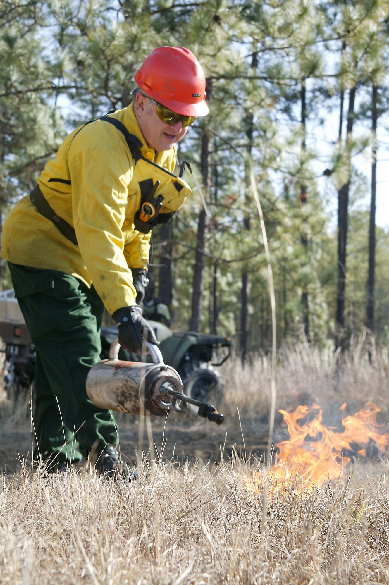 SHAW AIR FORCE BASE, S.C. -- Mr. Doug Back, 20th Civil Engineer Squadron forrester, ignites the grass for a test fire during a prescribed burn at Poinsett Electronic Combat Range Jan. 15. The main purpose for the prescribed burn is fuel reduction and to provide training for the 20th CES Fire Department. Approximately 52 acres were burned to prevent wildfires. (U.S. Air Force photo/Staff Sgt. John Gordinier)