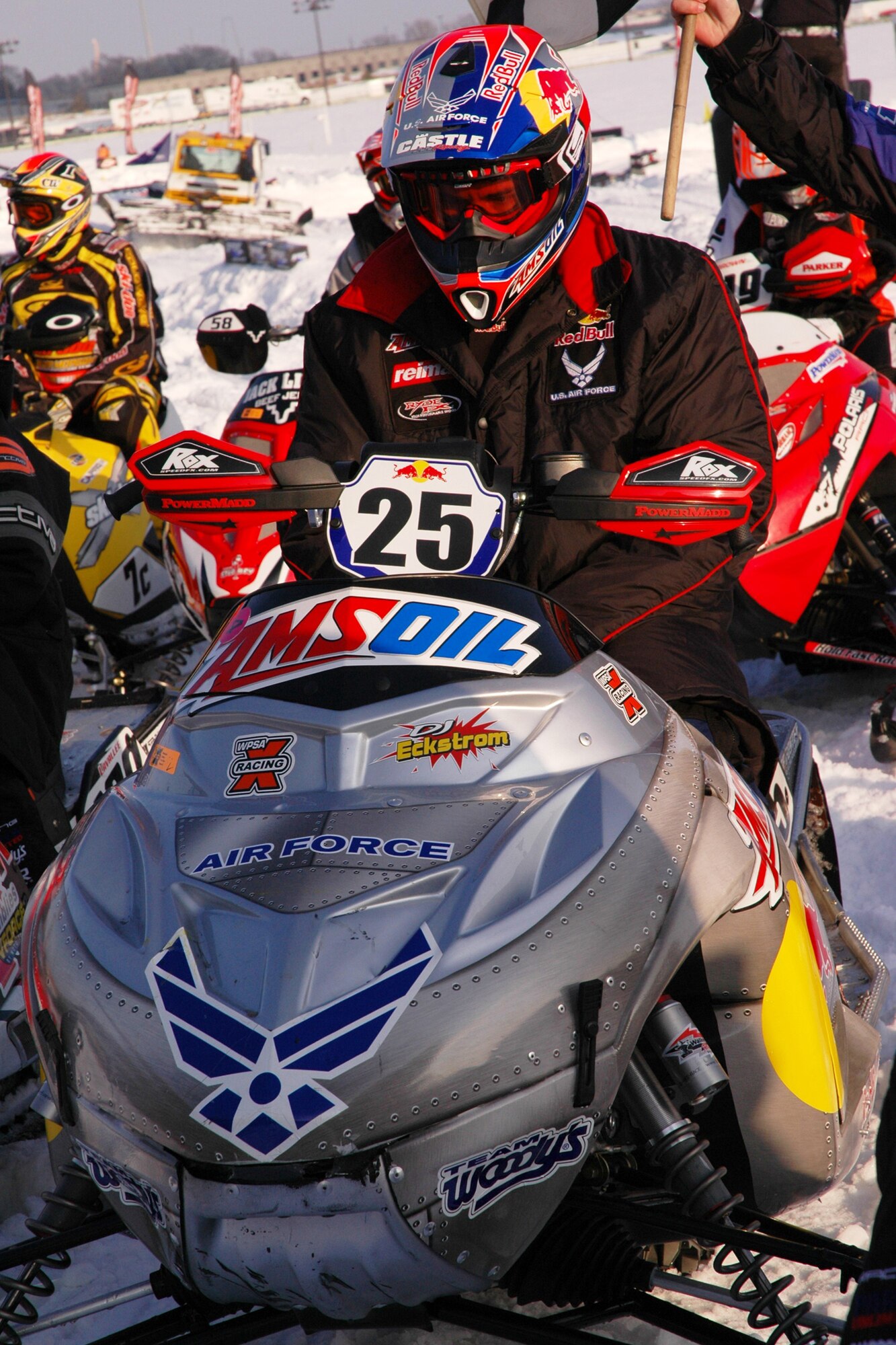 Scheuring racing team driver, Dennis "DJ" Eckstrom, revves up his snowmobile for competition at the January 2008 Air Force Canterbury SnoCross competition held in Shakopee, Minn., Jan. 12.