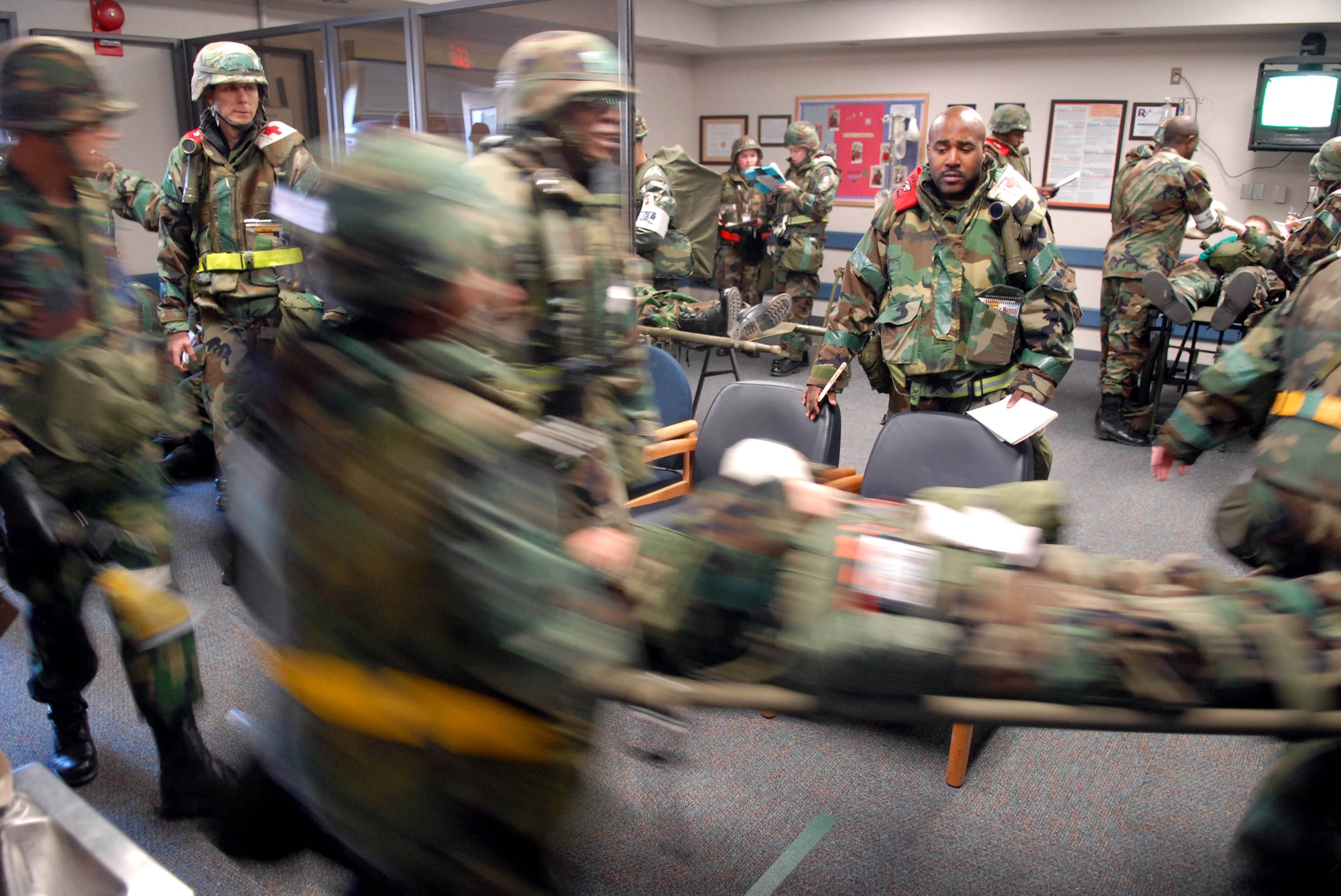 U.S. Air Force and the South Korea air force airmen escort a patient to triage after a mass causality scenario during the peninsula-wide operations readiness exercise Jan. 16 at Kunsan Air Base, South Korea. This training scenario between the South Korea air force and 8th Medical Group Airmen and demonstrates the teamwork necessary to carry out the combined mission of the two allies stationed at Kunsan AB. (U.S. Air Force photo/Senior Airmen Steven R. Doty) 
