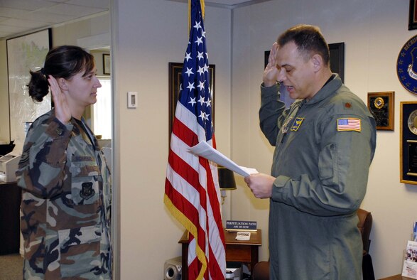 Tech. Sgt. Julie Schwebke is commissioned a 1st Lieutenant as she is given the oath by her father, Maj. Gordon Wix, both members of the 934th Airlift Wing.  The new lieutenant has nine years of service and her father, who was also prior enlisted, has more than 23.  Lieutenant Schwebke will work as a Medical Service Corps officer with the 934th Aeromedical  Evacuation Squadron where her father serves as a flight nurse. Air Force Photo/Master Sgt. Paul Zadach