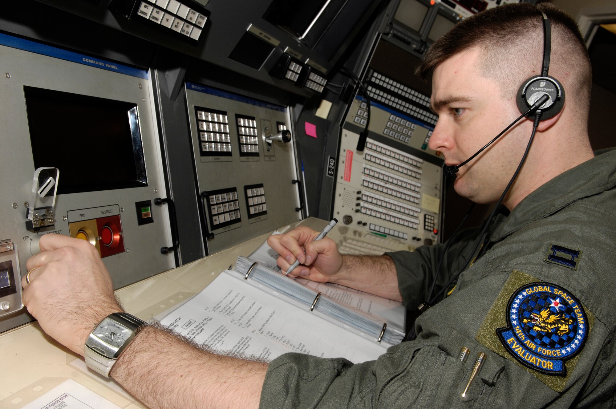 VANDENBERG AIR FORCE BASE, Calif. -- Capt. Jon Krepsky, a 30th Operations Support Squadron mission control flight officer, initiates explosive ordnance on board a rocket with a key turn switch during a training scenario on Jan. 14. Mission flight control officers are responsible for all flight control activities including launch preparation, pre-flight test and evaluations and flight control from liftoff to end of mission. The scenario is the deciding factor on who is selected to be on the elite 30th Space Wing Guardian Challenge Team.  Air Force Space Command hails GC as the only space war fighter competition in the Air Force. The competition pits the "best of the best" space war fighters against each other, determining the top space wing teams in the Air Force. The event captures the essence of competition through rigorous evaluation and increases the overall capabilities of operations teams to perform their missions. (U.S. Air Force photo/Airman 1st Class Christian Thomas)
