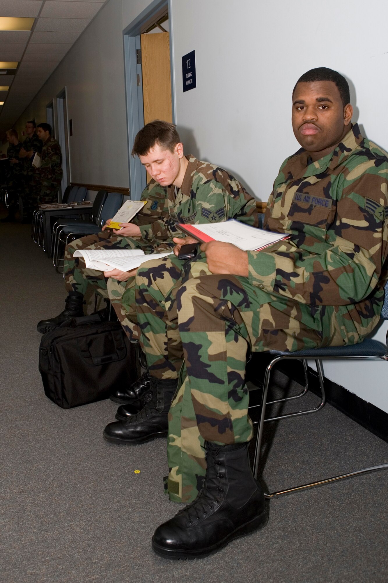 GRISSOM AIR RESERVE BASE, Ind.-- Senior Airmen Andre Sims and James Hlevyack, left, , security specialists with the 434th Security Forces Squadron, prepare for their annual long physicals at the 434th Aerospace Medicine Squadron. Long physical examinations are done every three years as mandated by Air Force regulations. (U.S. Air Force photo/Senior Airman Omar Delacruz)