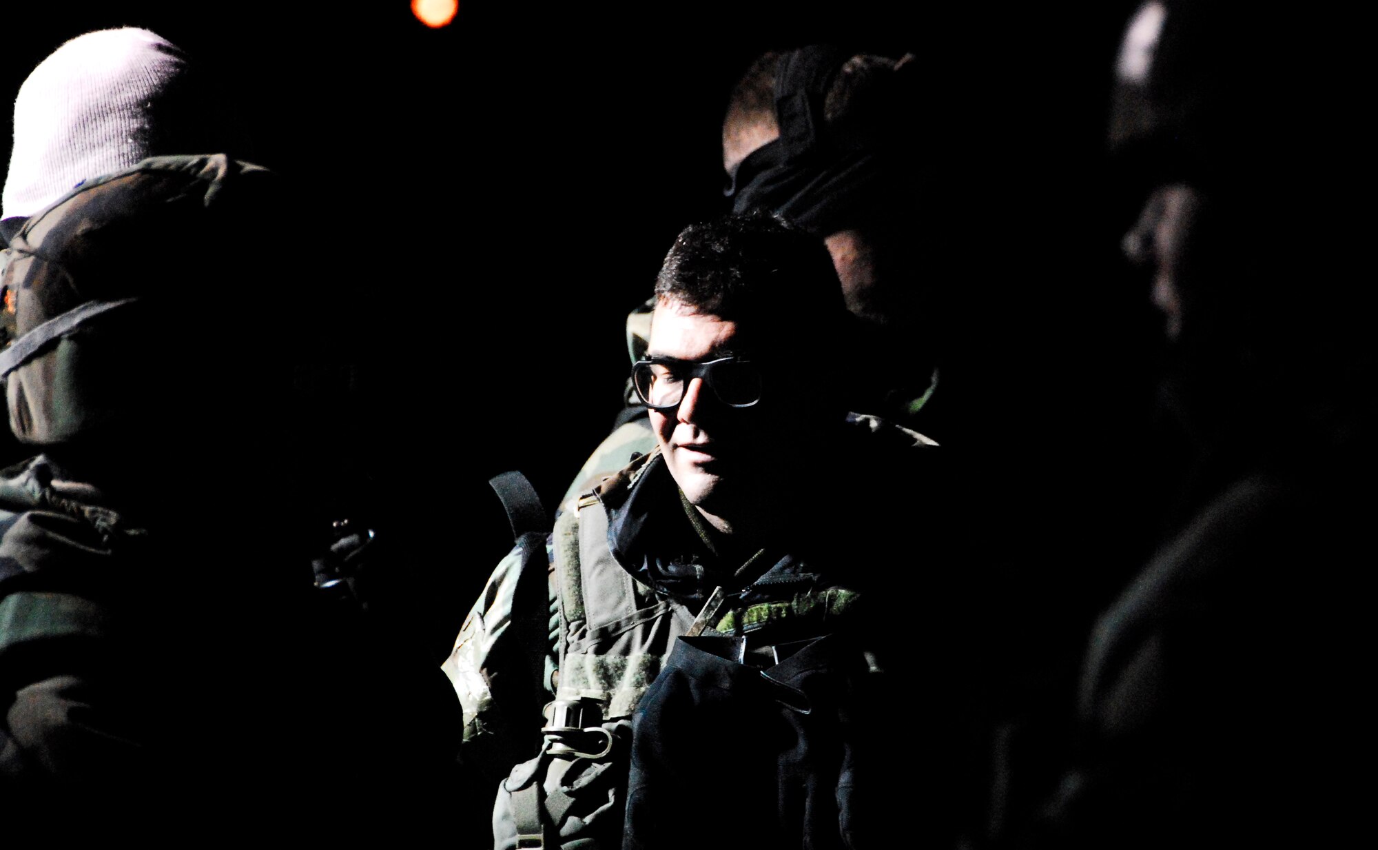 KUNSAN AIR BASE, South Korea -- Members of the 8th Security Forces Squadron gather for an out brief after a stimulated opposition forces attack during a peninsula wide operations readiness exercise (PENORE) here Jan 17.  The PENORE is conducted to ensure members of the Wolf Pack remain ready to execute the mission of maintaining peace and stability in the region.  (U.S. Air Force photo/Tech Sgt. Quinton T. Burris)