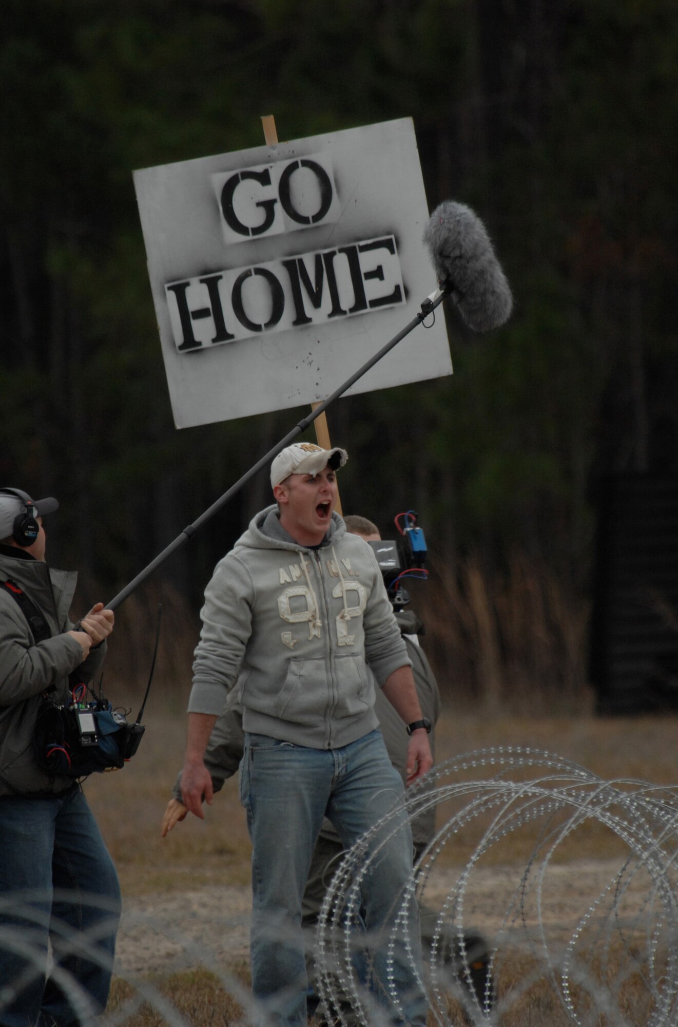 MOODY AIR FORCE BASE, Ga. -- An Airman playing a mock protestor is recorded by the 60 Minutes crew Jan. 12 here. The film crew was filming the employment of the Active Denial System for an upcoming segment on non-lethal weapons technologies. (U.S. Air Force photo by Airman 1st Class Gina Chiaverotti)
