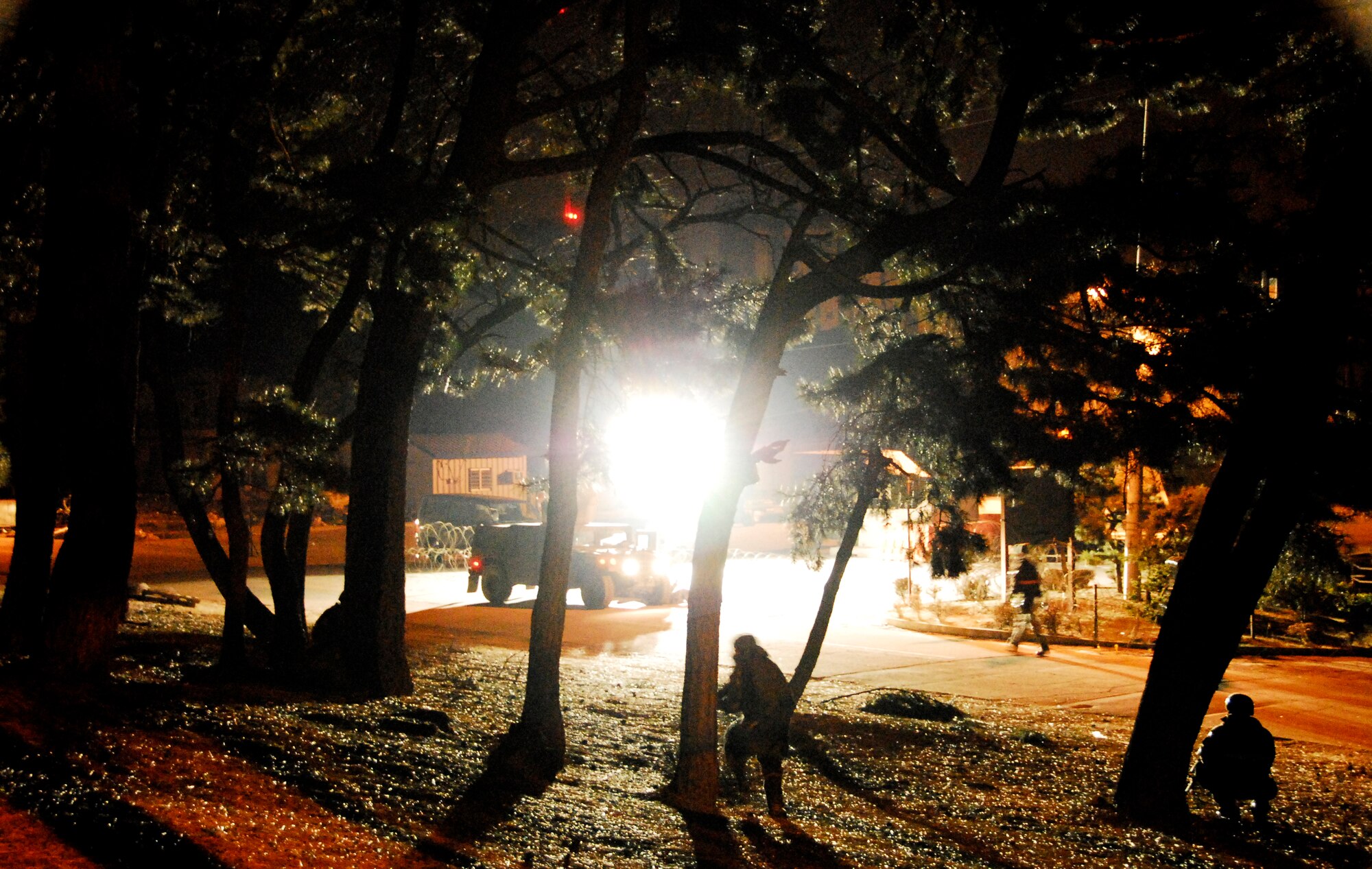 KUNSAN AIR BASE, South Korea -- Members of the 8th Security Force Squadron react to an opposition forces attack during a peninsula wide operations readiness exercise (PENORE) here Jan 17.  The PENORE is conducted to ensure members of the Wolf Pack remain ready to execute the mission of maintaining peace and stability in the region.  (U.S. Air Force photo/Tech Sgt. Quinton T. Burris)