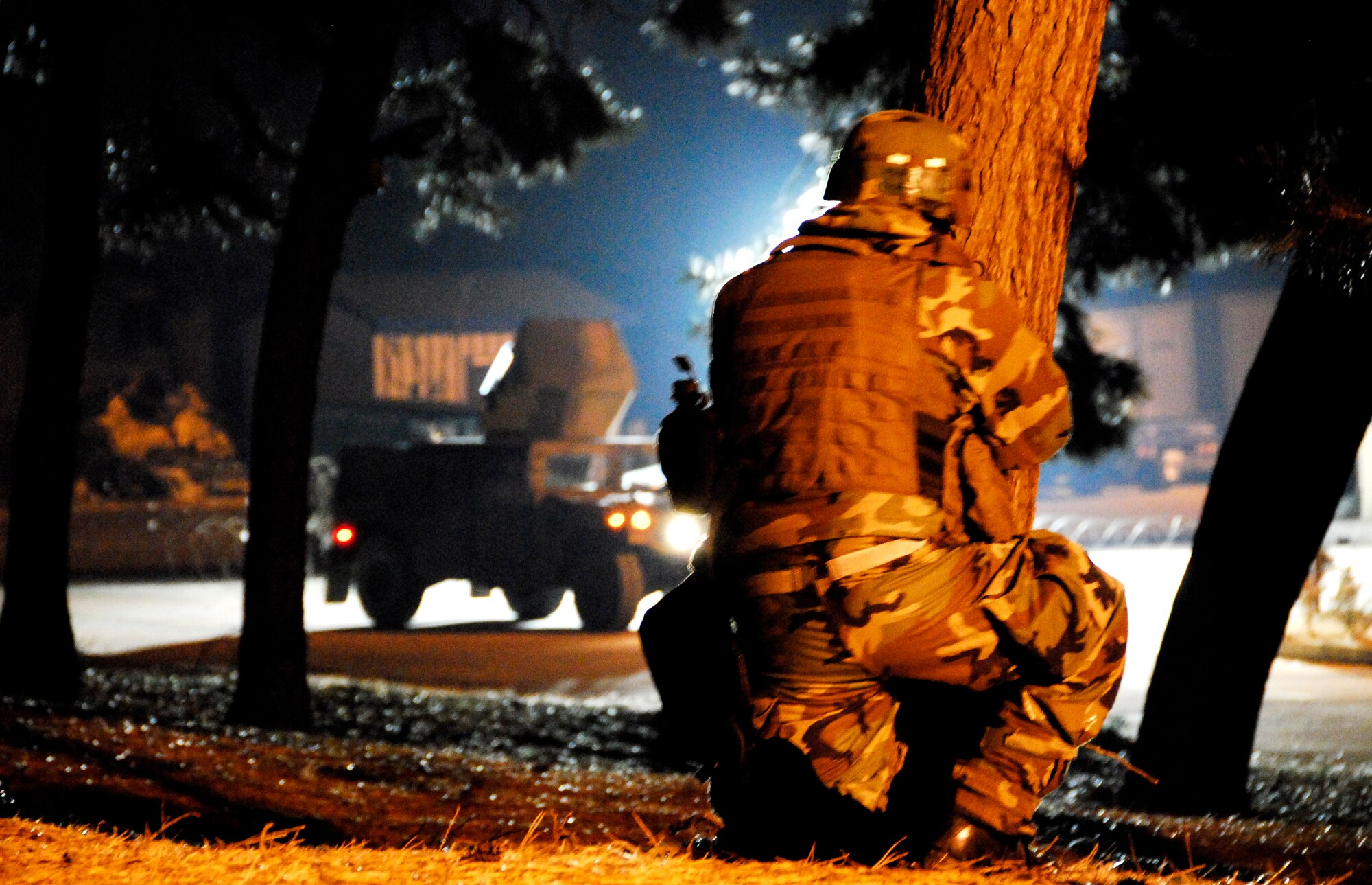 KUNSAN AIR BASE, South Korea -- A member of the 8th Security Force Squadron reacts to an opposition forces attack during a peninsula wide operations readiness exercise (PENORE) here Jan 17.  The PENORE is conducted to ensure members of the Wolf Pack remain ready to execute the mission of maintaining peace and stability in the region.  (U.S. Air Force photo/Tech Sgt. Quinton T. Burris)
