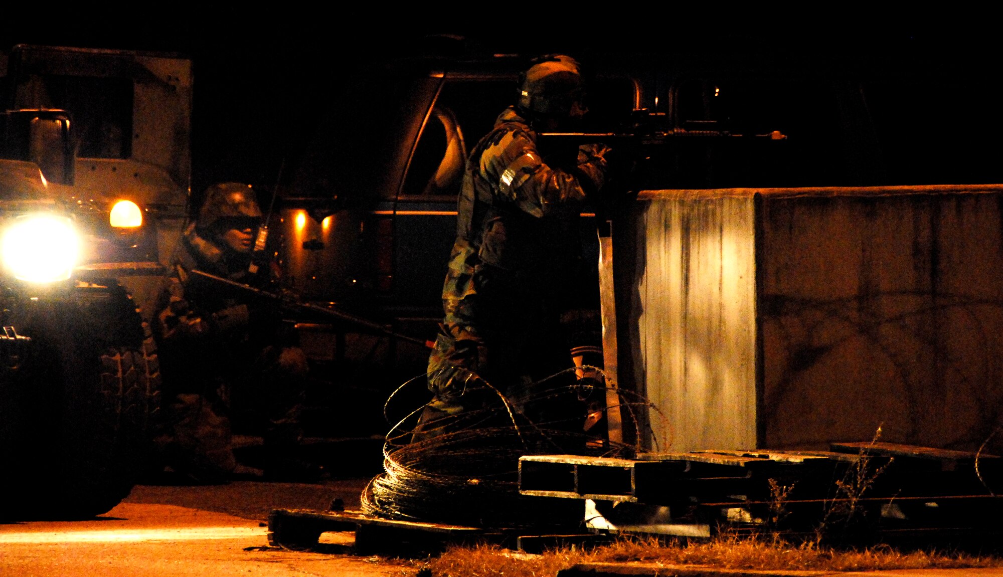 KUNSAN AIR BASE, South Korea -- Members of the 8th Security Force Squadron react to an opposition forces attack during a peninsula wide operations readiness exercise (PENORE) here Jan 17.  The PENORE is conducted to ensure members of the Wolf Pack remain ready to execute the mission of maintaining peace and stability in the region.  (U.S. Air Force photo/Tech Sgt. Quinton T. Burris)