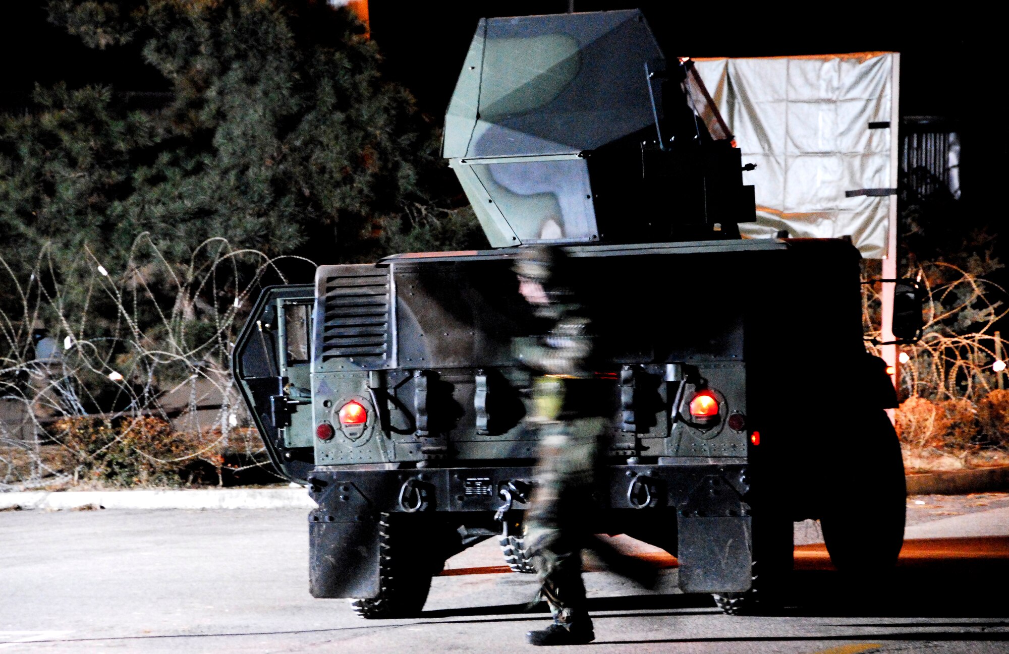 KUNSAN AIR BASE, South Korea -- A member of the 8th Security Force Squadron reacts to an opposition forces attack during a peninsula wide operations readiness exercise (PENORE) here Jan 17.  The PENORE is conducted to ensure members of the Wolf Pack remain ready to execute the mission of maintaining peace and stability in the region.  (U.S. Air Force photo/Tech Sgt. Quinton T. Burris)
