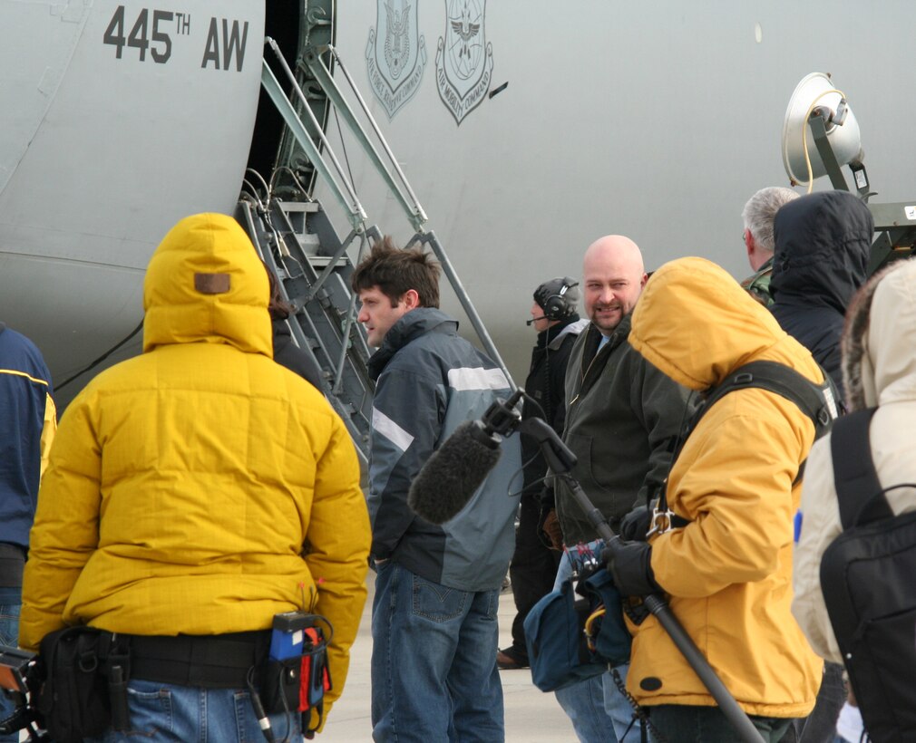 WRIGHT-PATTERSON AFB, Ohio - Ghost Hunters Grant Wilson and Jason Dawes along with Ghost Hunters crew members prepare to film some footage on a 445th Airlift Wing C-5.  The popular Sci Fi Channel T.V. show Ghost Hunters is filming their show in several buildings at Wright-Patterson AFB and filmed some footage of the 445th Airlift Wing's C-5 Galaxy Jan. 15, 2008 to help enhance the Air Force base setting for the show. (U.S. Air Force photo/Laura Darden)