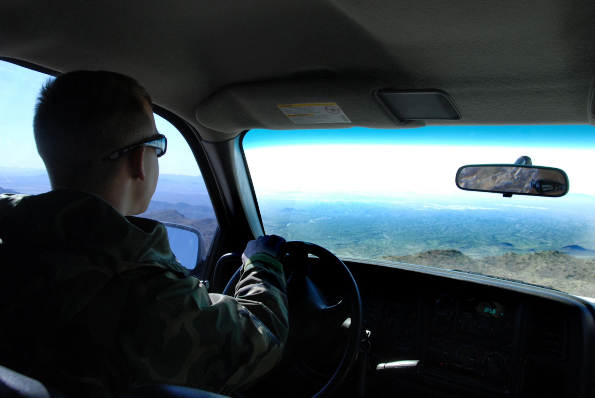 Senior Airman Robert MacCourt, 607th Air Control Squadron ground radio technician, navigates a turn on a road in the White Tank Mountains on his return to Luke.The 607th is a tennant unit of Luke, and conducts initial qualification training for operations crew personnel assigned to ACSs. 