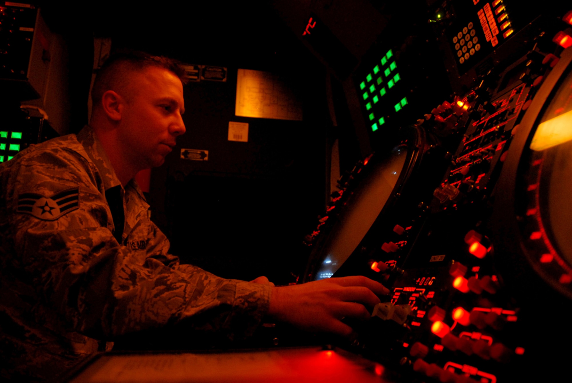 Senior Airman William Reid, 607th Air Control Squadron radar maintenance technician, looks for critical radar data on a scope inside the operations module.The 607th is a tennant unit of Luke, and conducts initial qualification training for operations crew personnel assigned to ACSs. 