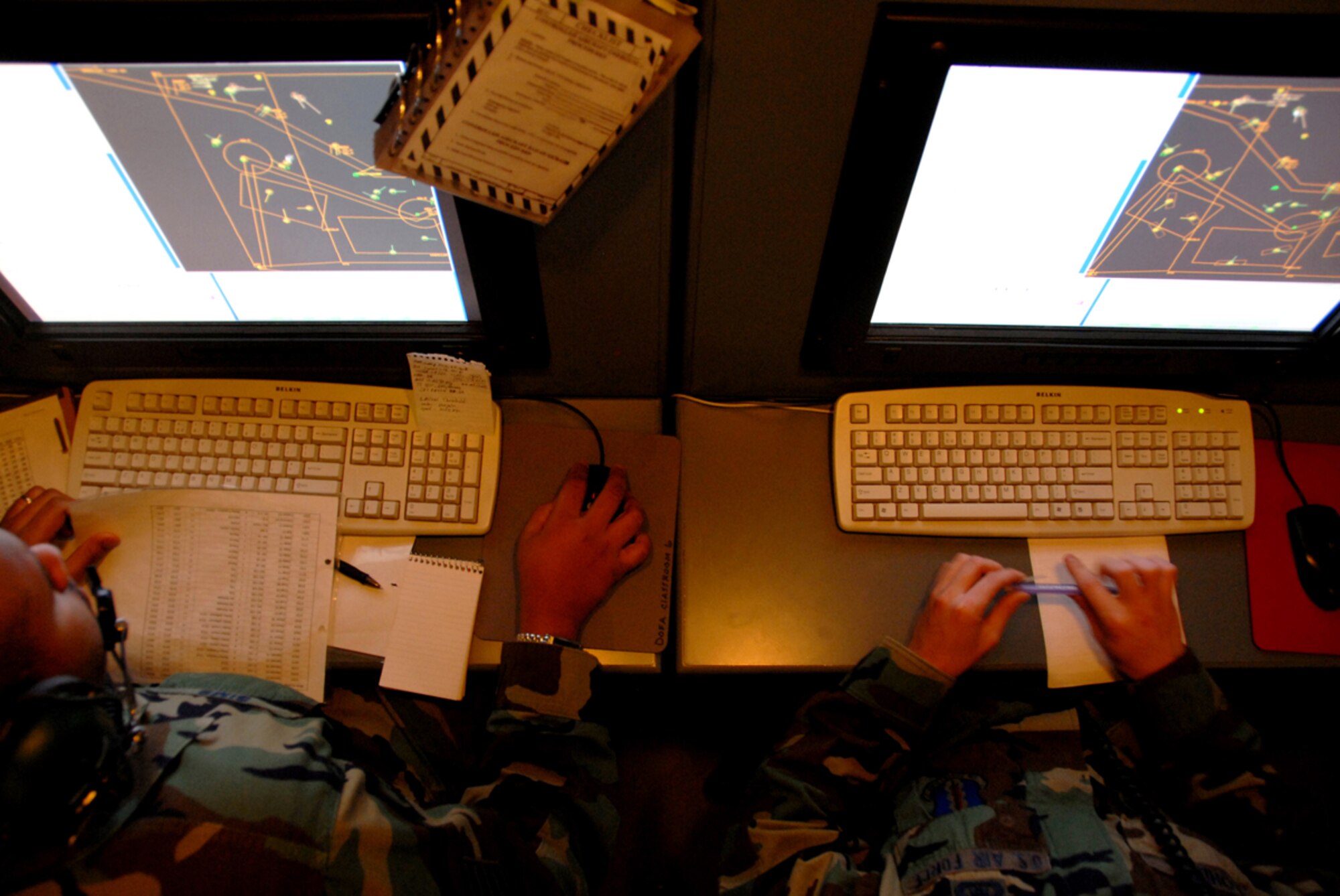 Two Airmen train in an operations module at the 607th Air Control Squadron.The 607th is a tennant unit of Luke, and conducts initial qualification training for operations crew personnel assigned to ACSs. 