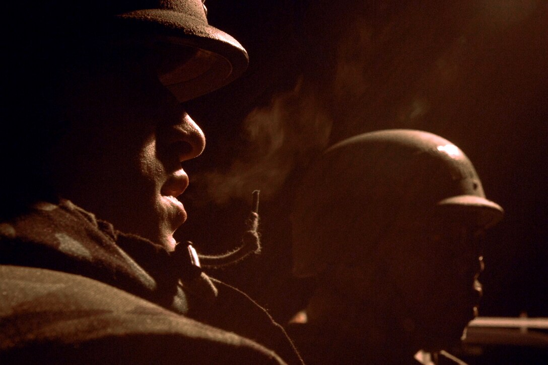 LANGLEY AIR FORCE BASE, Va. -- Airman 1st Class Hussein Hussein and Staff Sgt. Harold Gaines, 1st Civil Engineer Squadron, wait for a bus during a Phase II Operational Readiness Exercise Jan. 15. Airmen tasked for the exercise traveled to a simulated deployed location to prepare for the upcoming Operational Readiness Inspection in March, which will test their ability to survive and operate in a deployed environment. (U.S. Air Force photo/Airman 1st Class Vernon Young)