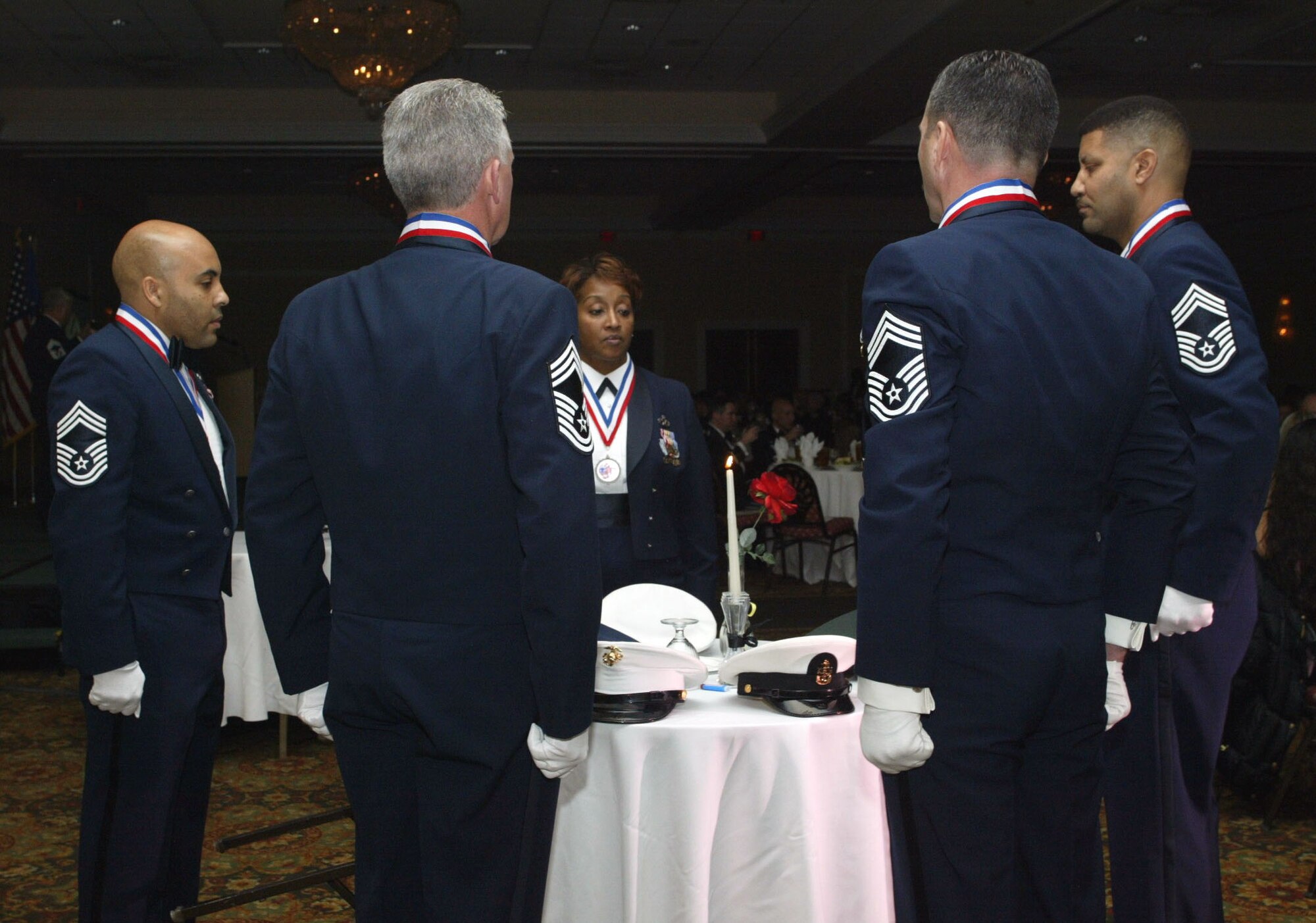 Chief Master Sgts Duren T. Harmon, Sandra A Wright, Howard C. Lee III, James R. Claffey and Wendell L. Peacock perform the POW/MIA dedication at the 2008 Dobbins Air Reserve Base Chiefs Induction Ceremony on Jan 5.  Fourteen inductees were honored as the Dobbins Chiefs Group hosted its sixth biannual induction ceremony at the Marietta Conference Center & Resort.  The inductees are military members who were promoted to the rank of chief master sergeant over the past year.  It is the service?s highest enlisted rank.(U.S. Air Force photo/Don Peek)