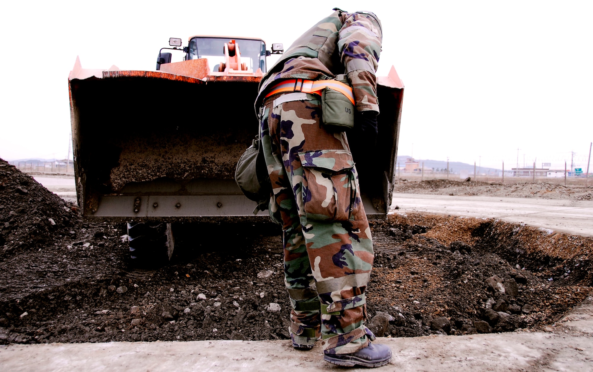 KUNSAN AIR BASE, South Korea -- Senior Airman Robert Kalert, 8th Civil Engineer Squadron, conduct airfield damage repair during a peninsula wide operations readiness exercise (PENORE) here Jan 17.  The PENORE is conducted to ensure members of the Wolf Pack remain ready to execute the mission of maintaining peace and stability in the region.  (U.S. Air Force photo/Tech Sgt. Quinton T. Burris)