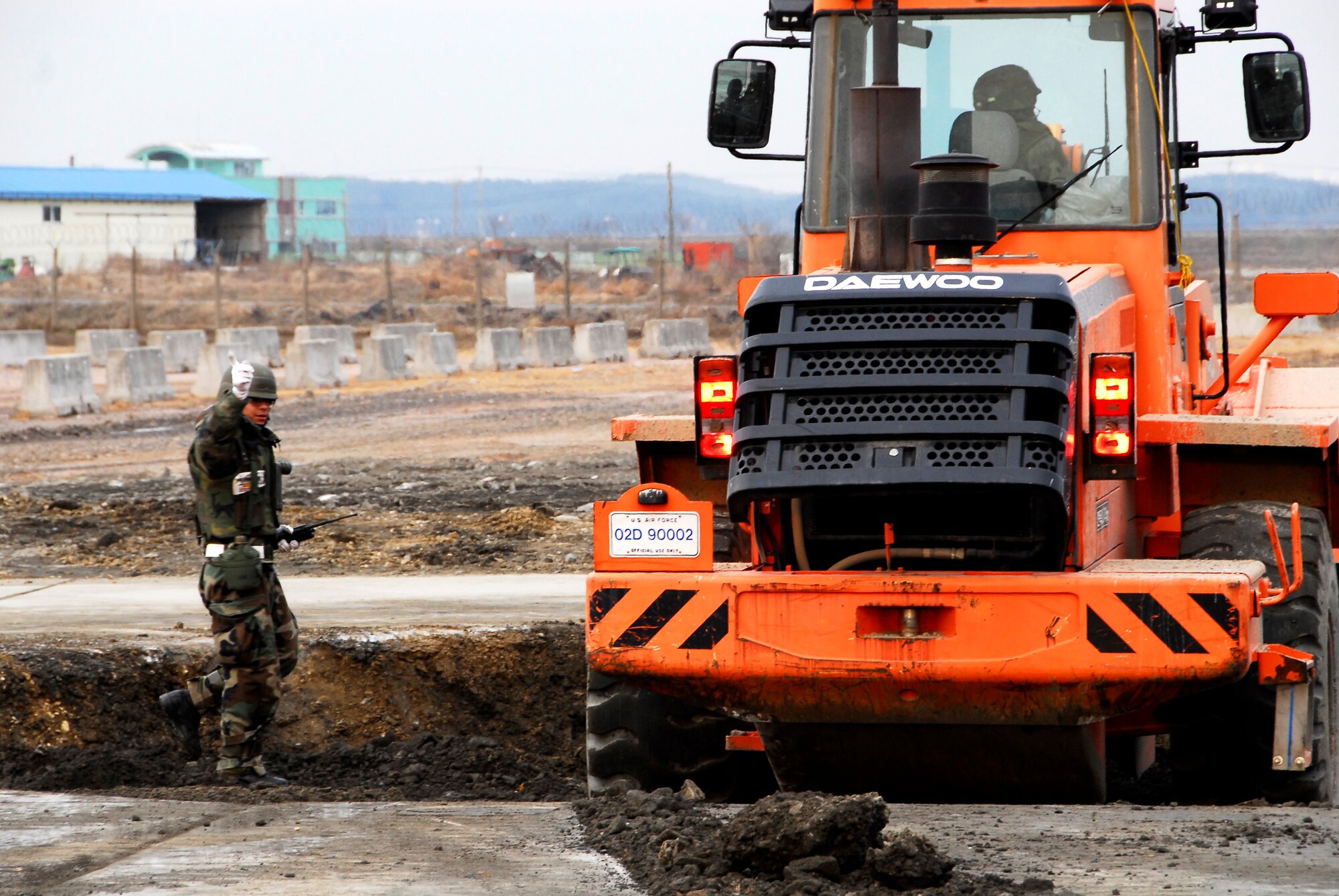 KUNSAN AIR BASE, South Korea -- Members of the 8th Civil Engineer Squadron conduct airfield damage repair during a peninsula wide operations readiness exercise (PENORE) here Jan 17.  The PENORE is conducted to ensure members of the Wolf Pack remain ready to execute the mission of maintaining peace and stability in the region.  (U.S. Air Force photo/Tech Sgt. Quinton T. Burris)