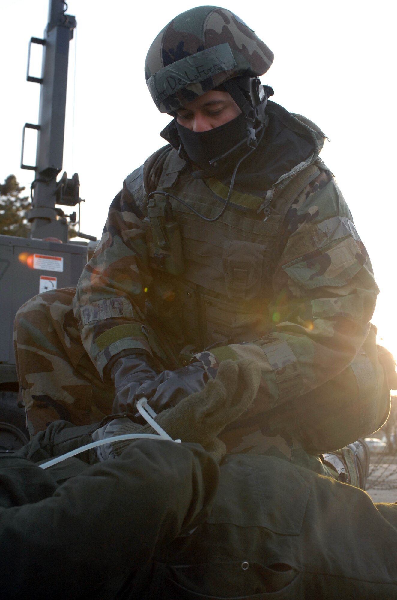 KUNSAN AIR BASE, South Korea -- Senior Airmen Alejandro DeLaFuente, 8th Security Forces Squadron, secures an enemy prisoner of war after a simulated attack on the Wing Operations Center during the peninsula wide operations readiness exercise here Jan. 17. The exercise is conducted to ensure members of the Wolf Pack remain ready to execute its mission of "Defending the Base, Accepting Follow on Forces and Taking the Fight North." (U.S. Air Force photo/Senior Airman Steven R. Doty)