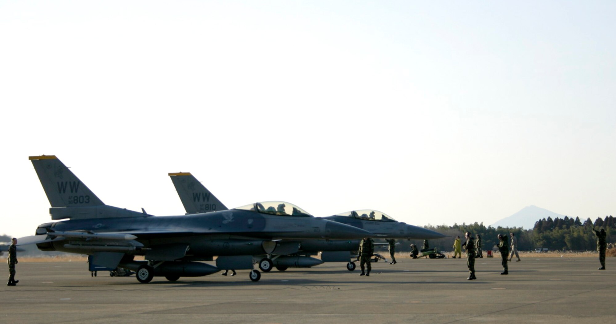 HYAKURI AIR BASE, Japan -- Crew chiefs from Misawa Air Base recover jets from the 14th Fighter Squadron after landing at Hyakuri Jan. 17, 2007. The jets and personnel were participating in an aviation training relocation exercise with the Japan Air Self Defense Force. This is the second year Misawa has participated in the exercise. (U.S. Air Force photo by Staff Sgt. Vann Miller)
