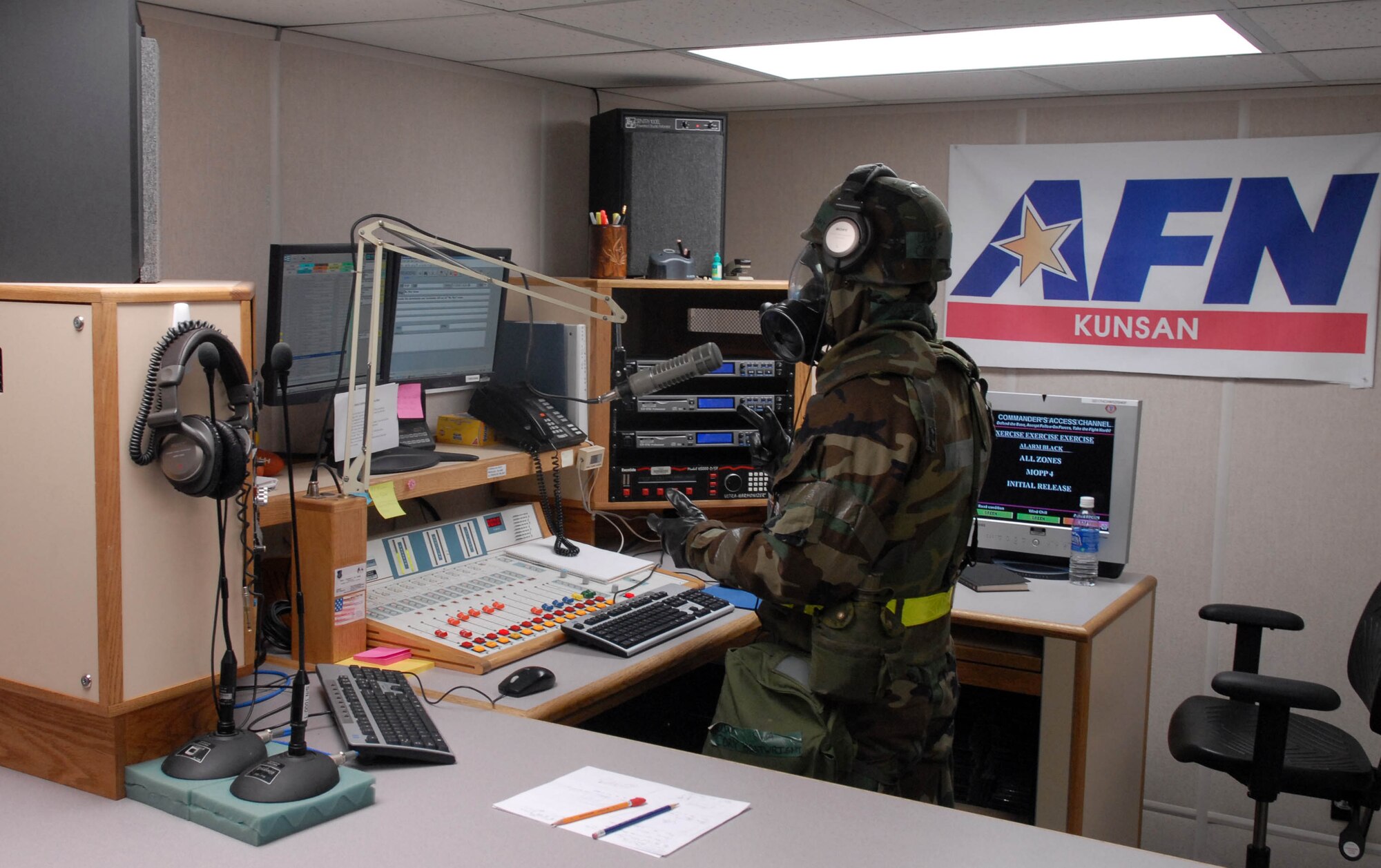KUNSAN AIR BASE, South Korea -- Senior Airman Cory Boatwright, American Forces Network broadcaster, updates the Wolf Pack on current conditions live over the radio during the peninsula wide operations readiness exercise here Jan. 17. The exercise is conducted to ensure members of the Wolf Pack remain ready to execute its mission of "Defending the Base, Accepting Follow on Forces and Taking the Fight North." (U.S. Air Force photo/Senior Airman Steven R. Doty)