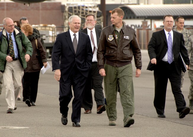 Col. John "Red" Millander, 437th Airlift Wing commander, Charleston AFB, S.C., walks with the Secretary of Defense, The Honorable Robert Gates, on Charleston AFB flightline, Jan. 18.  The secretary viewed the loading procedures of the Mine Resistant Ambush Protected Vehicles on a C-17 aircraft, and he also toured the integration, testing and installation of advanced electronic systems on the MRAP vehicles at the Space and Naval Warfare Systems Center Charleston, S.C. (U.S. Air Force photo/Airman 1st Class Katie Gieratz)