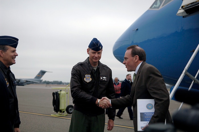 Col. John "Red" Millander, 437th Airlift Wing commander, Charleston AFB, S.C., greets a member of the Secretary of Defense?s staff as he comes of his aircraft and steps onto the Charleston AFB flightline Jan. 18.  The secretary viewed the loading procedures of the Mine Resistant Ambush Protected Vehicles on a C-17 aircraft, and he also toured the integration, testing and installation of advanced electronic systems on the MRAP vehicles at the Space and Naval Warfare Systems Center Charleston, S.C. (U.S. Air Force photo/Senior Airman Nicholas Pilch)
