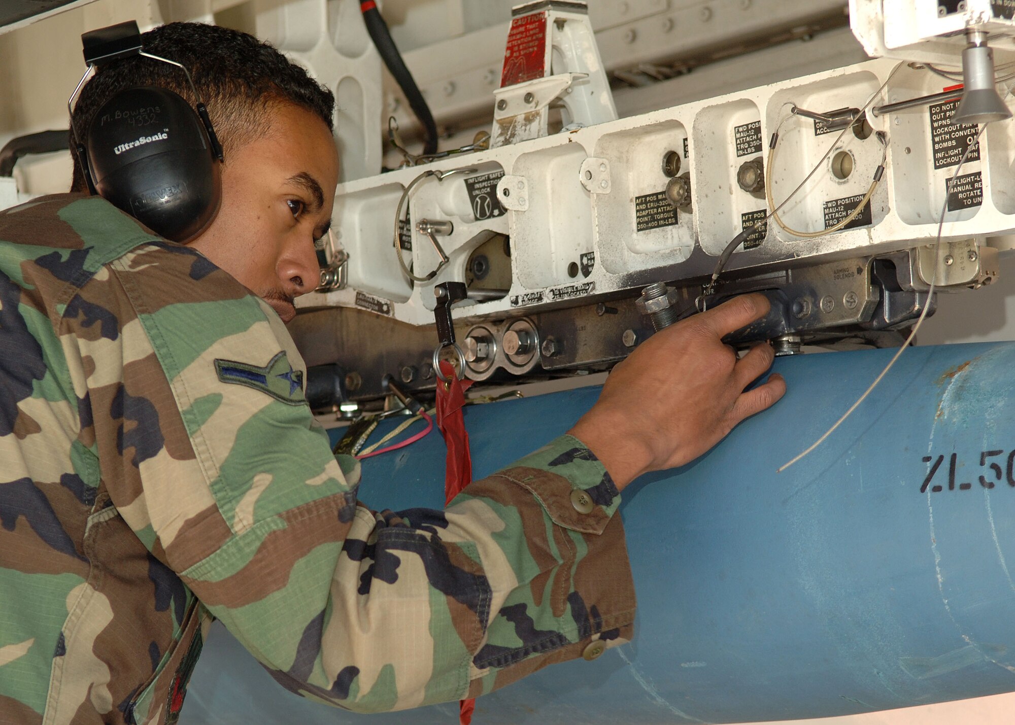 Airman Michael Bowens of the 49th Aircraft Maintenance Squadron secures the GBU-12 in the bomb door of the F-117A during the Weapons Load Crew of the Year Competition on Holloman Air Force Base, N.M., Jan.18, 2008. This is the final Weapons Load Crew of the Year Competition for the F-117A on Holloman. (U.S. Air Force photo/Airman 1st Class John D. Strong II)  