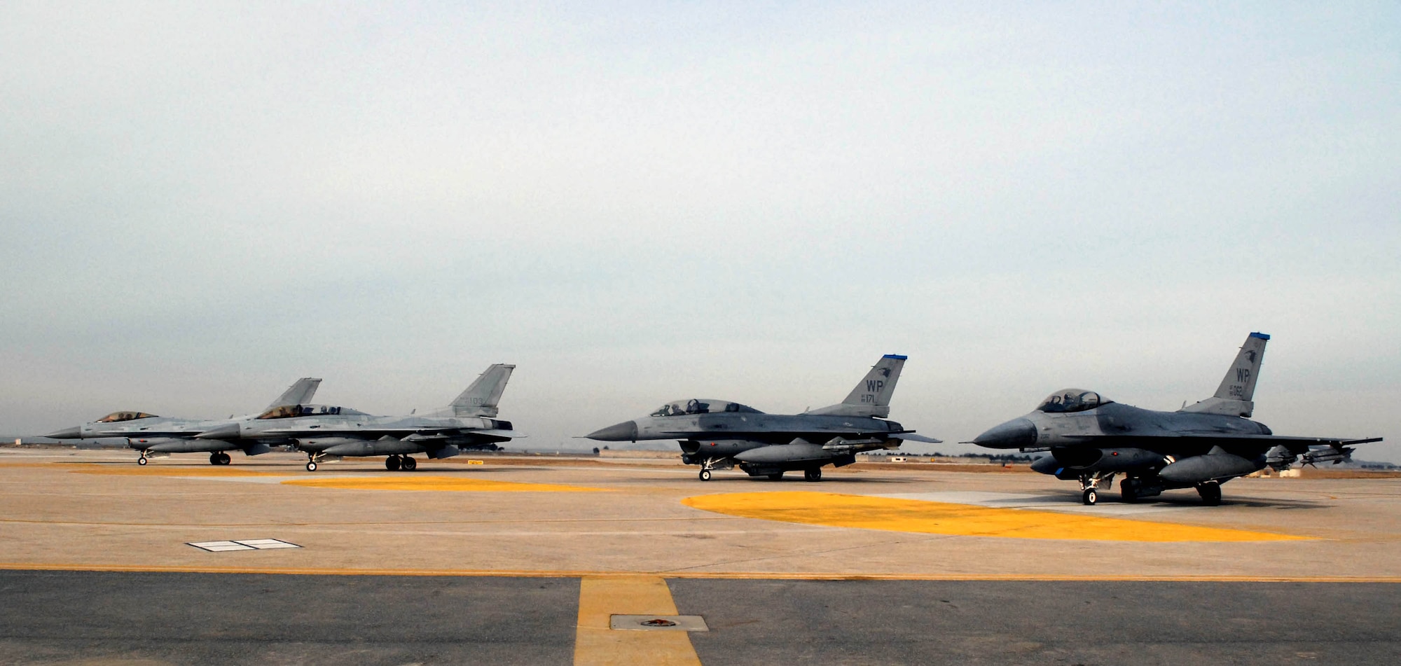 F-16 Fighting Falcon's from the U.S. Air Force and  South  Korea air force line up prior to take-off for joint flying operations during the peninsula wide operational readiness exercise Jan. 17 at Kunsan Air Base, South Korea. The exercise is conducted to allow the U.S.servicemen and Korean air force members to become even stronger allied partners and continue to provide peace and stability to the region.  (U.S. Air Force photo/Senior Airman Steven R. Doty)