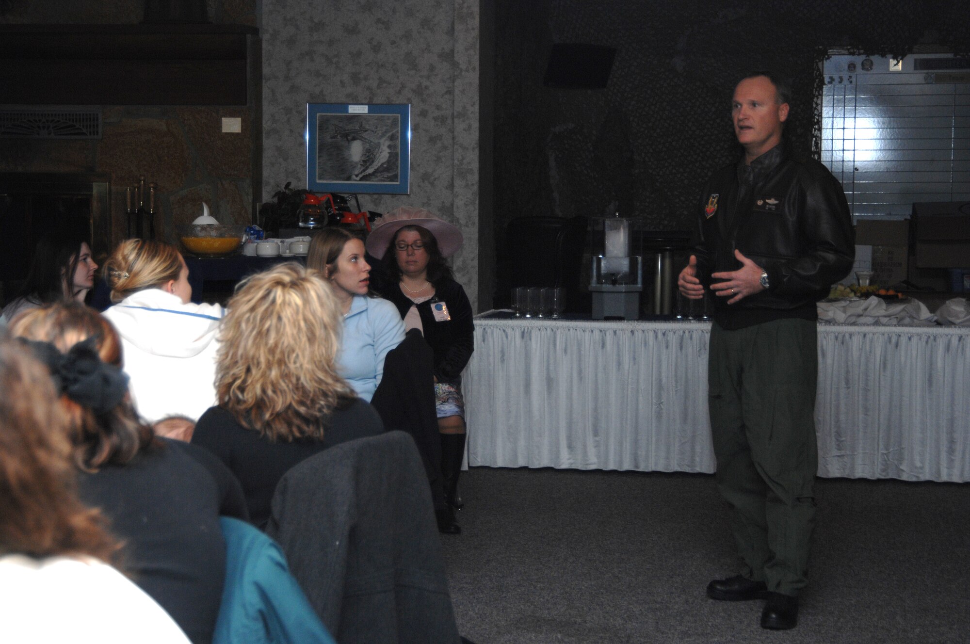 MOUNTAIN HOME AIR FORCE BASE, Idaho -- Col. James Browne, 366th Fighter Wing commander. welcomes Gunfighter spouses to the Airmen and Family Readiness Center's Heart Link class at the Gunfighter Club here Jan. 11. Each quarter, spouses new to the base have the opportunity to attend the class to get familiarized with what the base has to offer and learn about life in the Air Force. (U.S. Air Force photo/Airman 1st Class Samantha S. Crane)