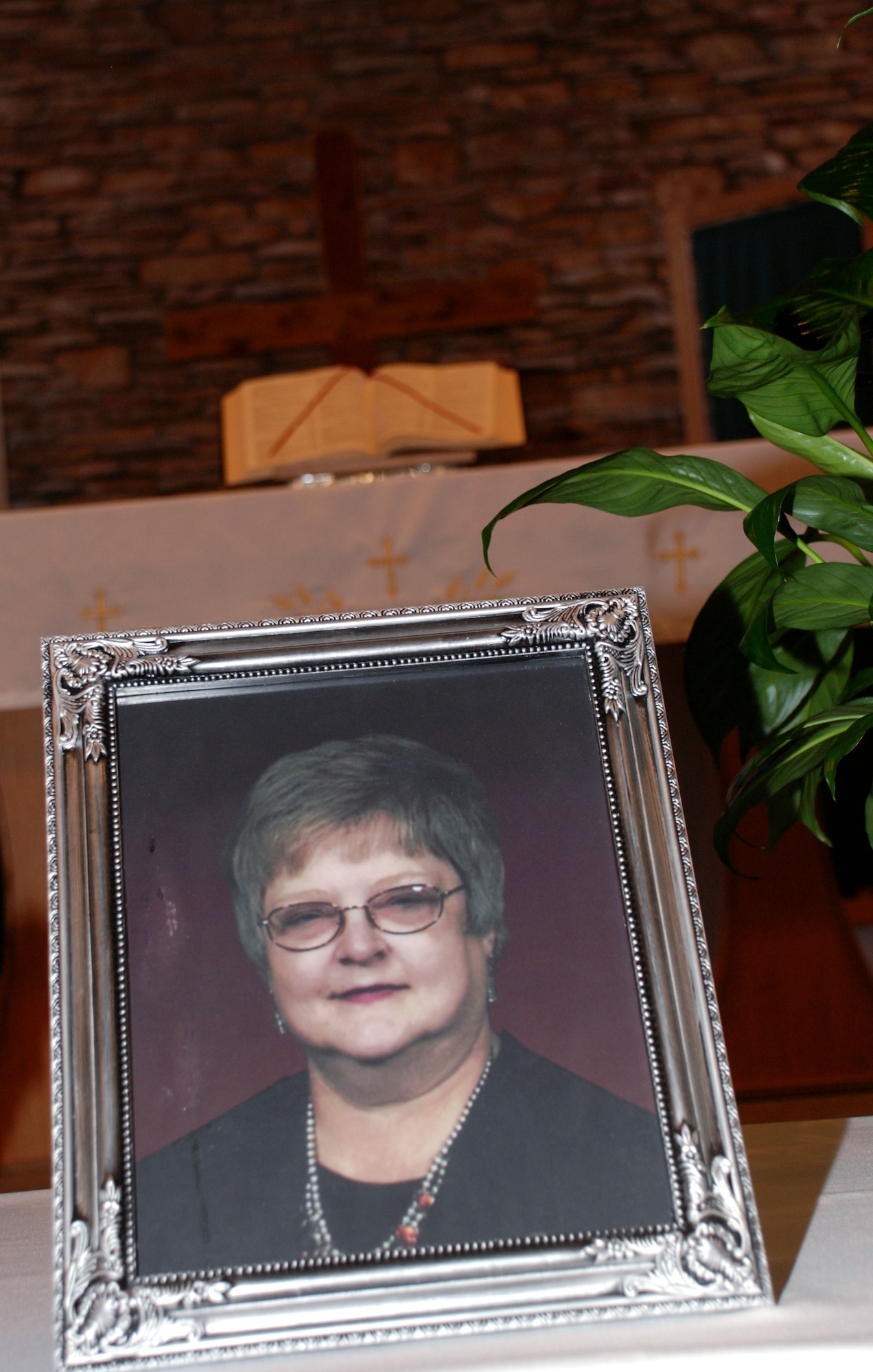 A picture of Tandy Weaver, 82nd Contracting Squadron director of buisness operations, sits at the North Chapel during a memorial service in her honor Jan. 18. Ms. Weaver passed away Jan. 12. (U.S. Air Force photo/Airman 1st Class Jacob Corbin)