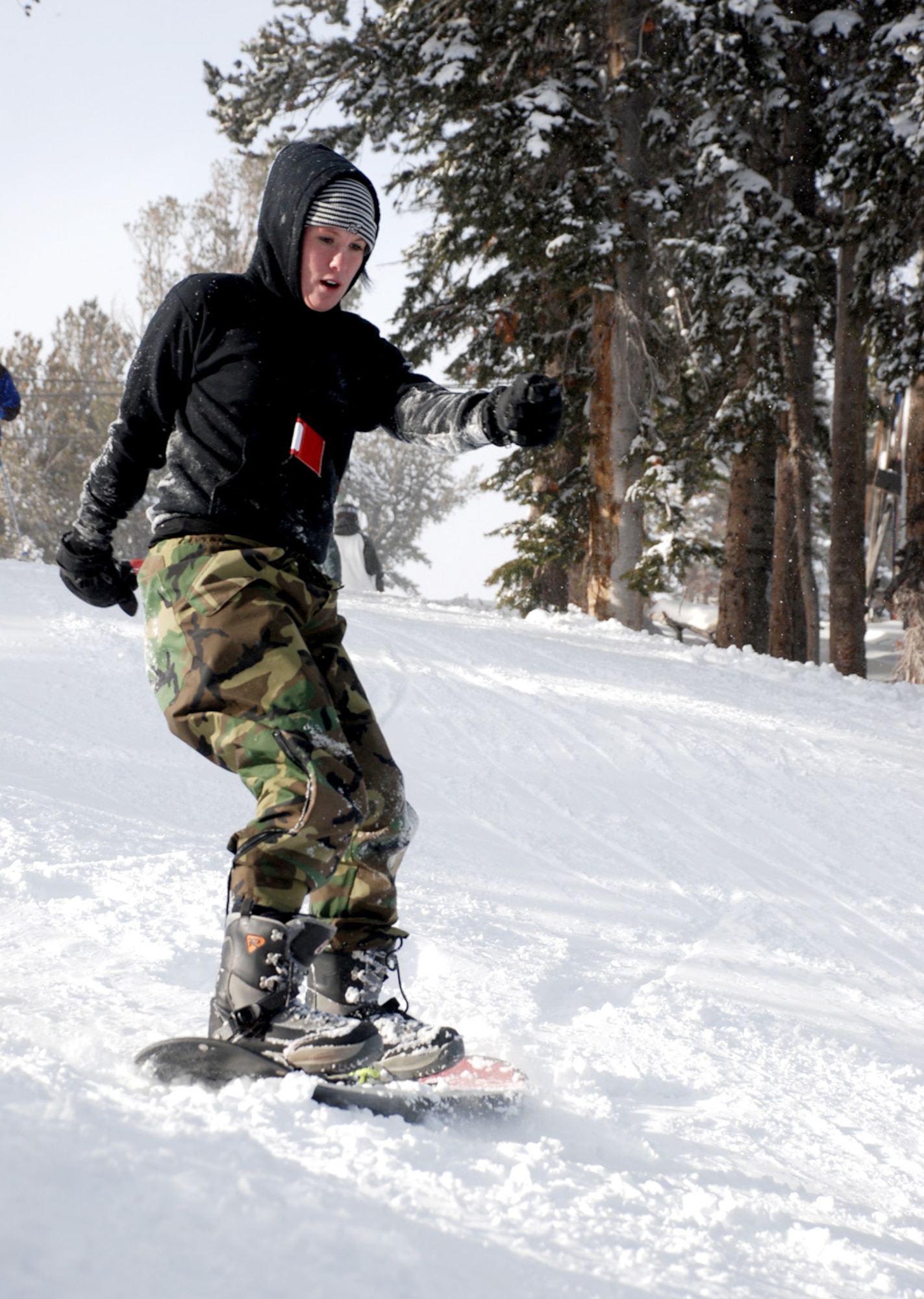 Airman 1st Class Rebecca Kincaid, 790th Missile Security Forces Squadron, snowboards down an intermediate trail at Snowy Range Ski and Recreation Area during the ski trip Jan. 12. Warren Outdoor Recreation scheduled the trip and 31 Warren members participated.