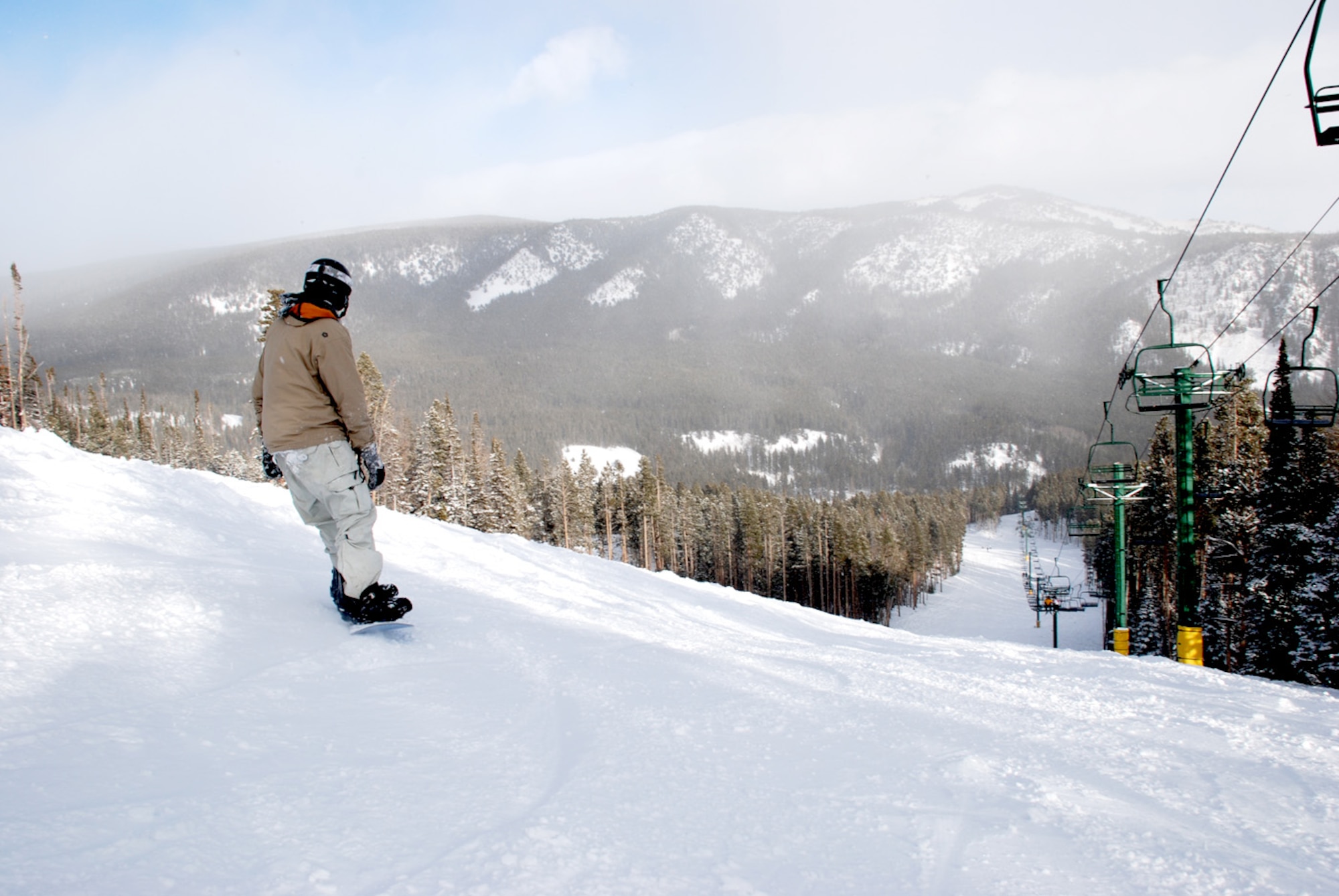 A snowboarder prepares to ride down the Shoshoni trail at Snowy Range Ski and Recreation Area Jan 12. Warren Outdoor Recreation prepares ski trips to most local ski resorts (U.S. Air Force photos/Airman 1st Class Daryl Knee).