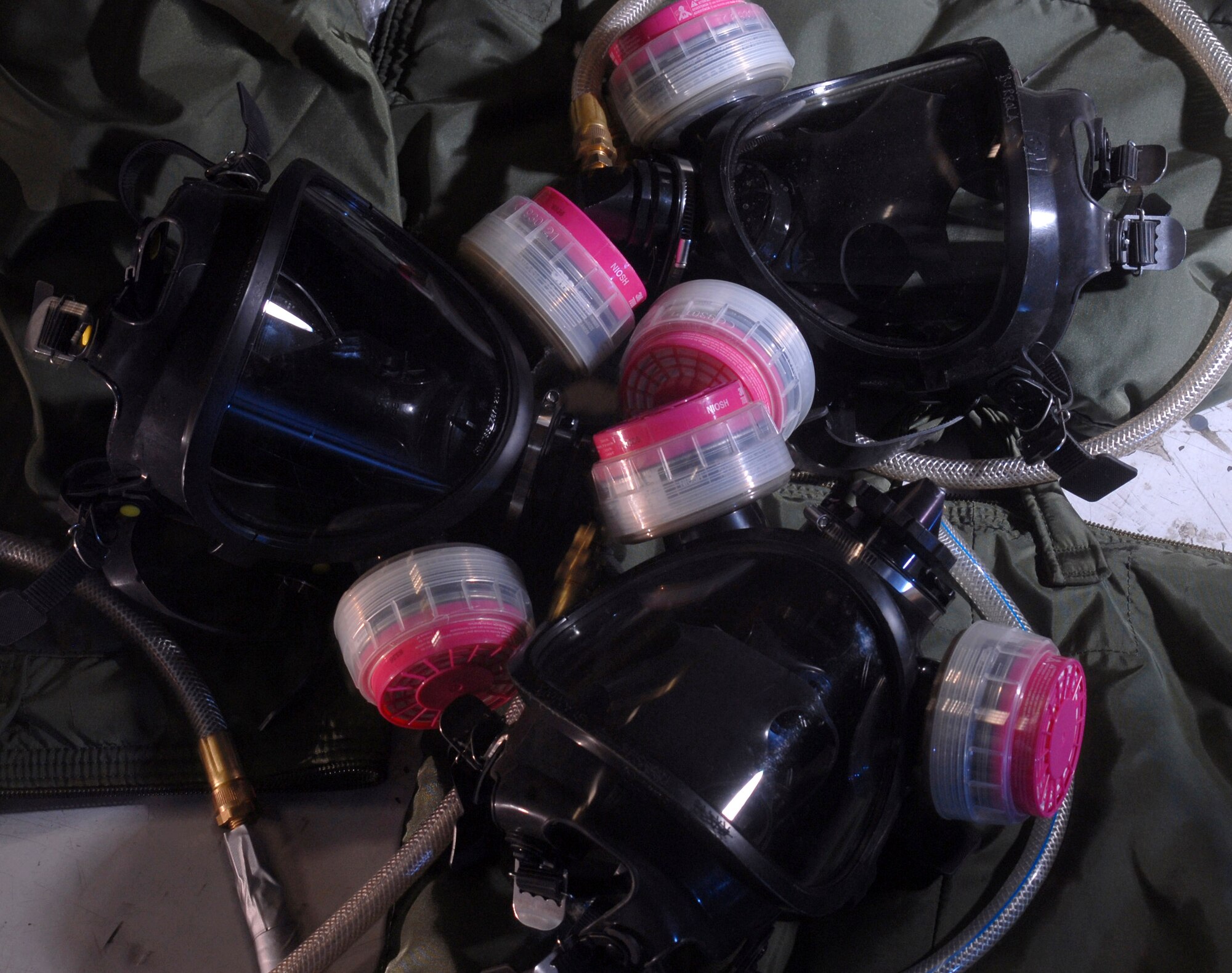 Full-face supplied air respirators are used by fuel cell technicians from the 452nd Maintenance Squadron to inspect aircraft fuel tanks Jan. 9 at March Air Reserve Base, Calif. (U.S. Air Force photo/Val Gempis) 