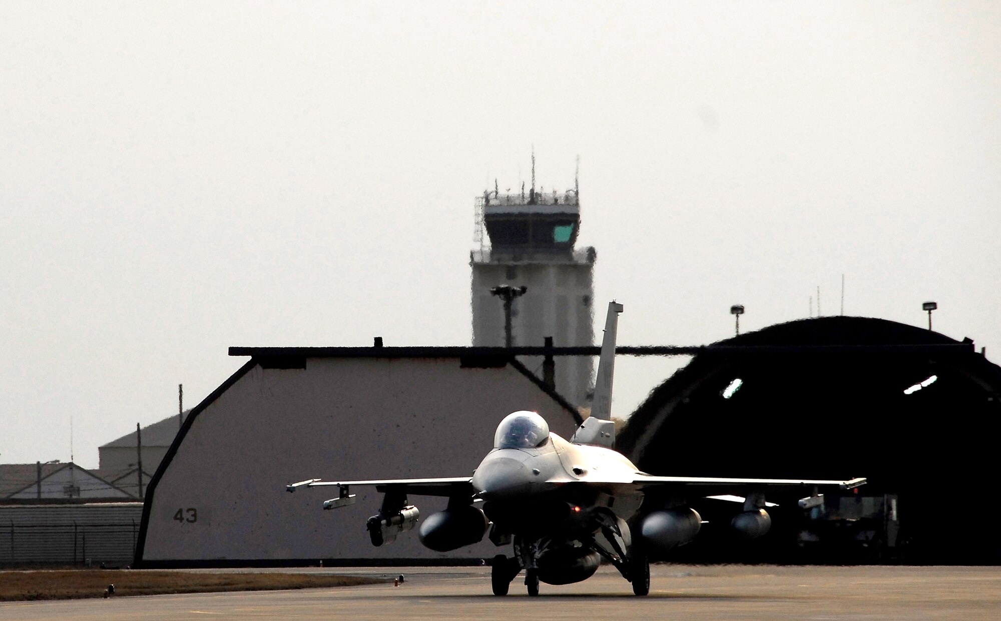 An F-16 Fighting Falcon taxies to a hangar at Kunsan Air Base, South Korea, after a Jan. 18 flight from Eielson Air Base, Alaska. The 80th Fighter Squadron will be receiving 18 Common Configuration Implementation Program Block 40 jets from the Alaskan-based unit and Eielson AFB will in-turn receive the 80th FS Block 30 jets for an aggressor squadron. (U.S. Air Force photo/Tech Sgt. Quinton T. Burris)