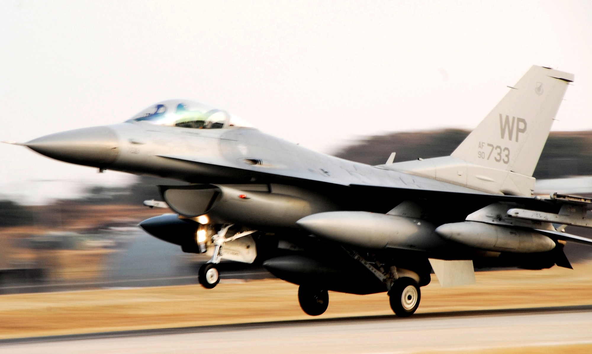 An F-16 Fighting Falcon lands at Kunsan Air Base, South Korea, after a Jan. 18 flight from Eielson Air Base, Alaska. The 80th Fighter Squadron will be receiving 18 Common Configuration Implementation Program Block 40 jets from the Alaskan-based unit and Eielson AFB will in-turn receive the 80th FS Block 30 jets for an aggressor squadron. (U.S. Air Force photo/Tech Sgt. Quinton T. Burris)