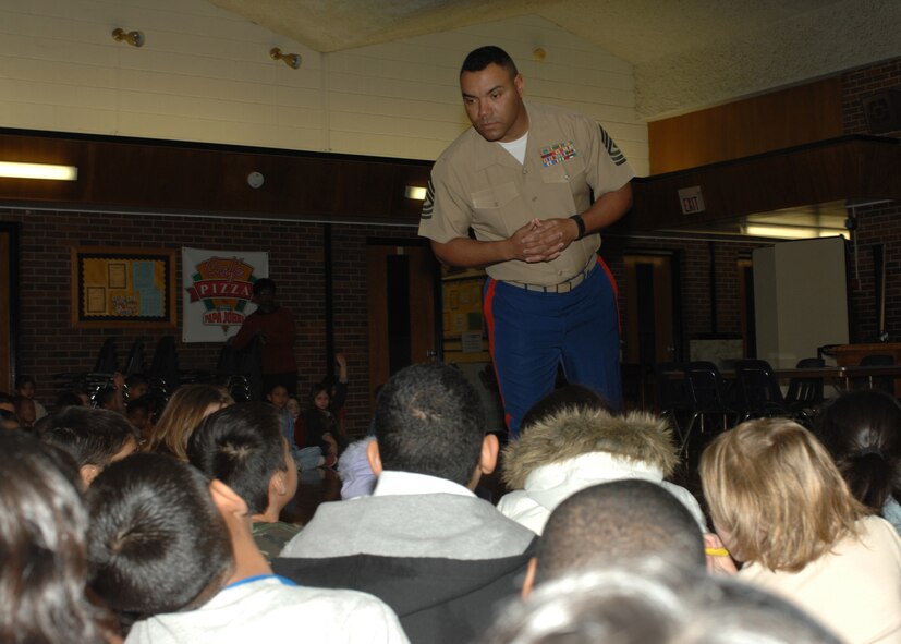 Marine First Sergeant Alfred Sly, Marine Det. 1 Dyess AFB, answers questions about bullying for students at Lee Elementary School, Jan. 17. The Marines from Detachment-1 explain the importance of working as a team and not discriminating against anyone. (U.S. Air Force photo by SrA Courtney Garrard)