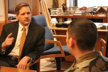 Airman First Class Joe Rivera, 5 Bomb Wing Photographer, interviews Governor John Hoeven about his life, politics, and his pride in the military Jan. 11. Gov. Hoeven expressed his appreciation for all military members and their families. (U.S. Air Force photo by Major Laurie Arellano)