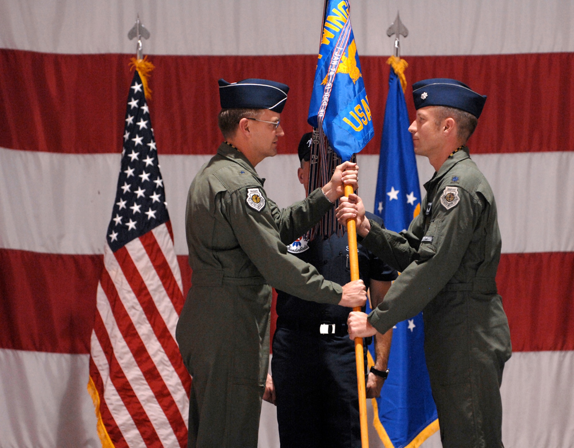 Lt. Col. Greg Thomas assumes command of the U.S. Air Force Air Demonstration Squadron from Brig. Gen. Stephen Hoog, 57th Wing commander, in a ceremony held here, Jan. 11. (U.S. Air Force photo by Tech. Sgt. Justin Pyle)