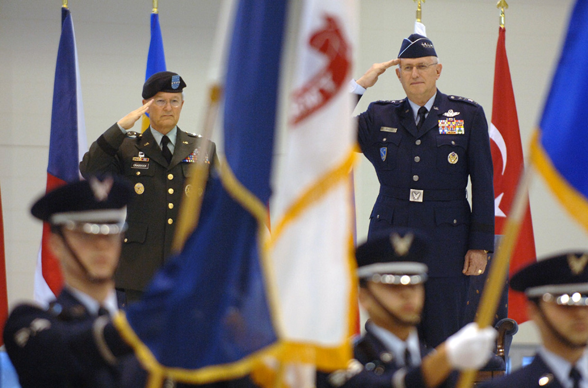 Gen. Roger A. Brady and Gen. John Craddock salute during the Jan. 17 assumption of command ceremony at Ramstein Air Base, Germany. General Brady is the new U. S. Air Forces in Europe commader and General Craddock is the Supreme Allied Commander, Europe. As USAFE commander, General Brady also has three other titles: commander, Allied Air Component Command Ramstein; air component commander, U.S. European Command, Ramstein AB, Germany; and director, Multinational Joint Air Power Competence Center, Kalkar, Germany. (U.S. Air Force photo/Master Sgt. D. Scott Wagers) 