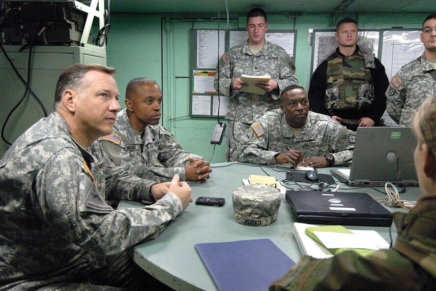 Army leadership, including Col. Christopher Putko, front, 31st Air Defense Artillery Brigade commander, are briefed on the exercise halfway through the two-week training. The group toured the area and were briefed frequently by Soldiers.  Command Sgt. Major Michael Banes said the Soldiers were getting “good, good training” here and added that future combined training opportunities were “only limited by our imagination”.  (Air Force photo by Margo Wright)
