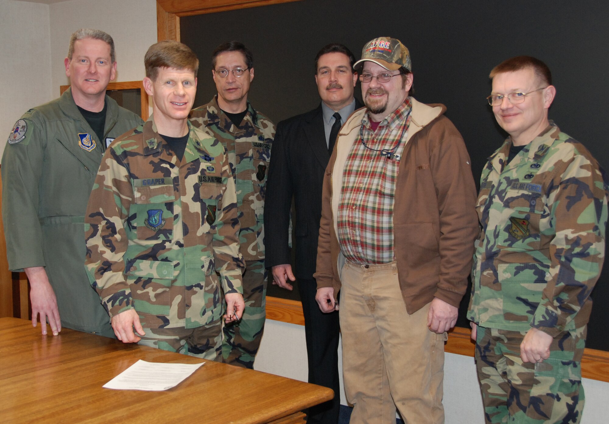 EIELSON AIR FORCE BASE, Alaska--Wing leadership signed a Voluntary Protection Program agreement Jan. 17 solidifying the Wing's commitment to achieve safety and health excellence through the Occupational Safety and Health Administration.  Pictured are: Col. Mark Moore, 354th Operations Group commander, Brig. Gen. Mark Graper, 354th Fighter Wing commander, Col. John Stutts, 354th Mission Support Group commander, George Bennett, American Federation of Government Employees president, Michael Goodwin, 168th Air Refueling Wing union president and Col. Michael Welch, 354th Maintenance Group commander. The two signatories not present are Col. Howard Hayes, 354th Medical Group commander and Col. John Griffin, 168th Air Refueling Wing commander.  (U.S. Air Force photo by Airman 1st Class Nora Anton)