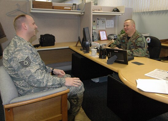 Master Sgt. Cary Loeffler, 28th Operations Support Squadron superintendent, counsels Tech. Sgt. James Powell, 28th Operations Group noncommissioned officer in charge of information management. Part of Sergeant Loeffler's responsibilities as superintendent is to oversee the proffessional development of the enlisted force. (U.S. Air Force photo / Senior Airman Joshua Stevens) 
