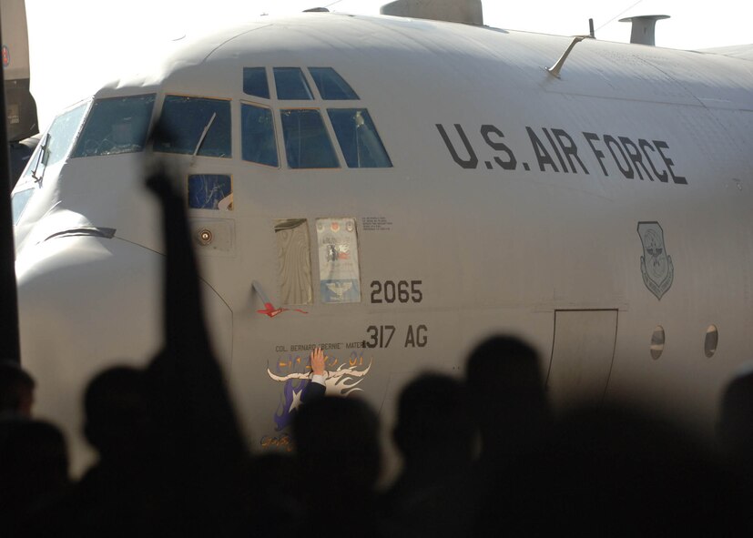DYESS AFB, Tx-- The newest, 317th Airlift Group Commander, Colonel Bernard "Bernie" Mater, along with members of the 317th Airlift Group, view his named placed on the C-130 Hercules. (U.S. Air Force photo by Airman 1st Class Micheal Breaux)