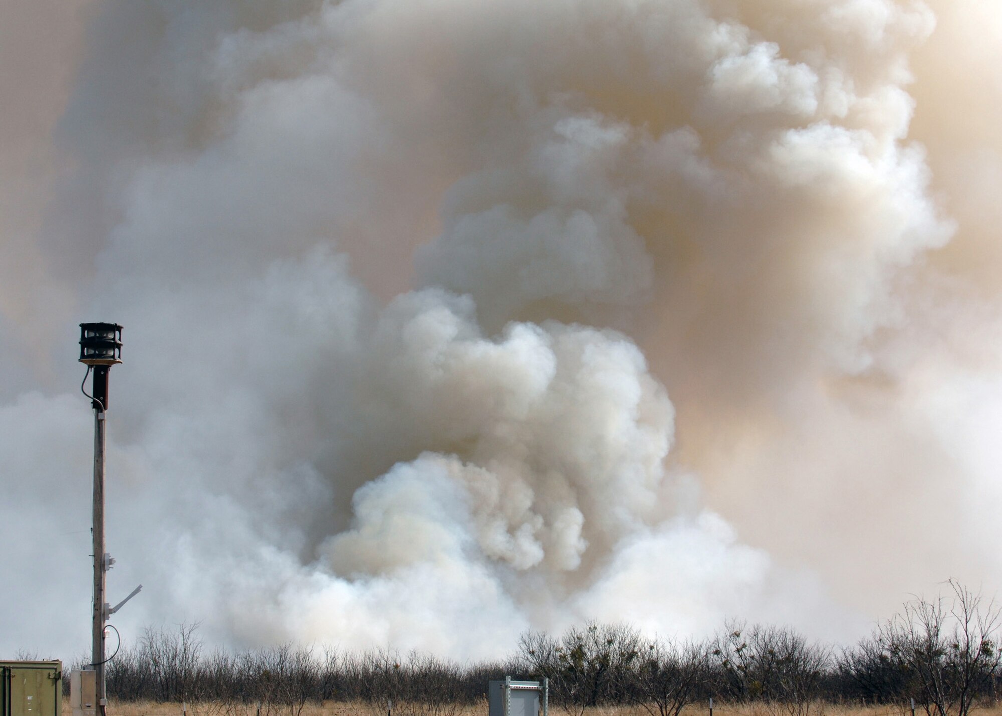 DYESS AFB, Texas -- A cloud of smoke and ash from a controlled burn roll across Dyess Air Force Base Jan. 17. The 115 acre burn will help prevent future uncontrolled wildfires and will help wildlife habitats. (U.S. Air Force photo by Airman 1st Class Micheal Breaux)