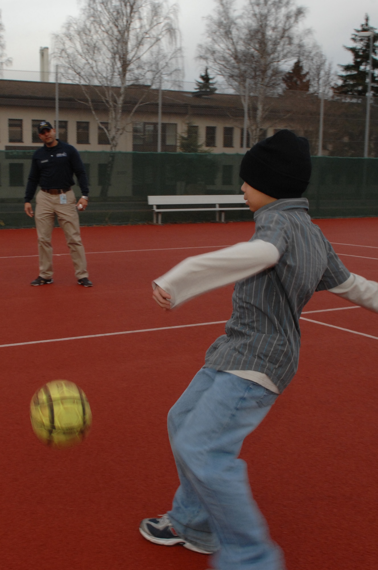 Cristian Fernandez plays kick ball with his dad, Staff Sgt. David Fernandez, Health and Wellness Center Diet Therapist Craftsman, on Jan. 15, 2007.  The HAWC is offering a new program called Lets Eat Smart Then Exercise Right (LESTER) which focuses on keeping children healthy by working with the whole family.  (U.S. Air Force photo/Airman 1st Class Amber Bressler)(RELEASED)