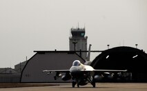 KUNSAN AIR BASE, South Korea -- An F-16 that is part of the Common Configuration Implementation Program taxis to its parking spot after a flight from Eielson Air Base, Alaska here Jan 18. The 80th Fighter Squadron will be receiving 18 CCIP Block 40 jets from the Alaskan based unit and Eielson will in-turn receive the 80th FS Block 30 jets for an aggressor squadron.  (U.S. Air Force photo/Tech Sgt. Quinton T. Burris)