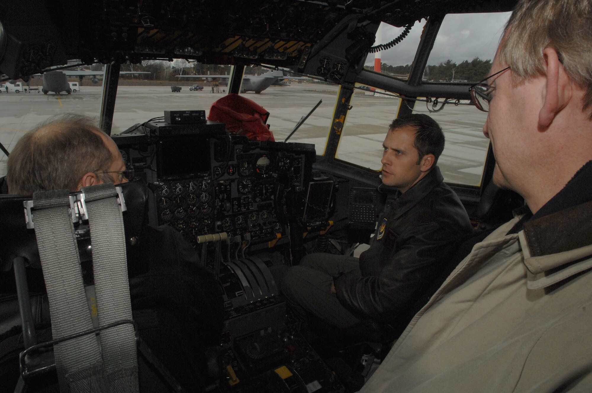 Capt. Ryan Kiernan, 86th Airlift Wing, flight safety office, describes a C-130E aircraft to visitors from local air sport clubs on Jan. 16. The local nationals were visited to discuss issues with air traffic in the Rheinland-Pfalz area.  (U.S. Air Force photo by Airman 1st Class Amber Bressler)(RELEASED)