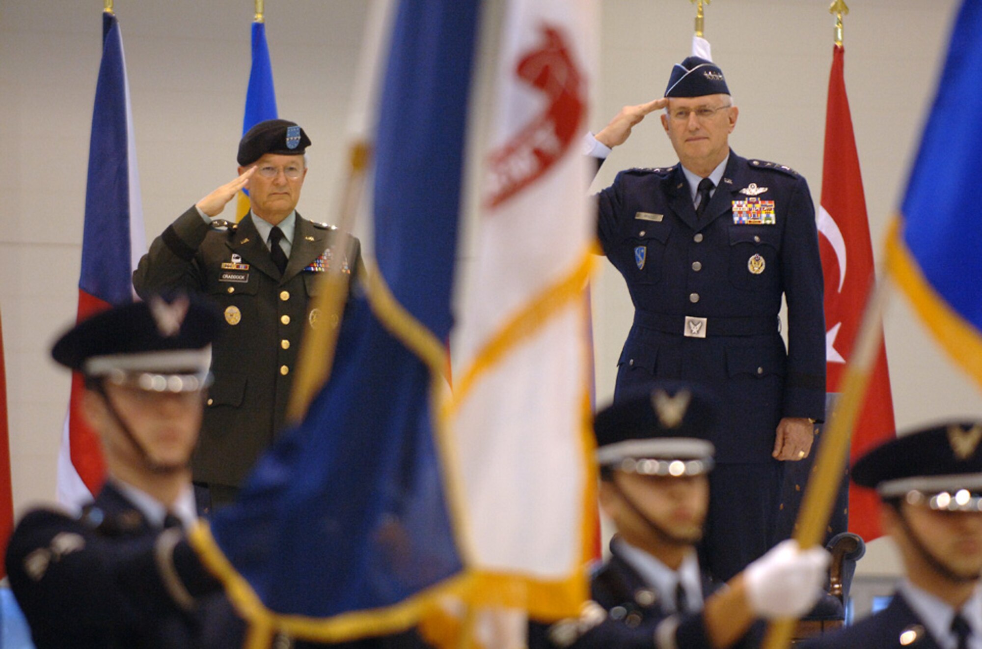 General Roger A. Brady, Commander, United States Air Forces in Europe, and Gen. John Craddock, Supreme Allied Commander, Europe, salute during the Jan. 17 assumption of command ceremony at Ramstein Air Base, Germany.  As USAFE commander, Gen. Brady also has three other titles: commander, Allied Air Component Command Ramstein; air component commander, U.S. European Command, Ramstein AB, Germany; and director, Multinational Joint Air Power Competence Center, Kalkar, Germany. (Photo by Master Sgt. D. Scott Wagers, USAF)